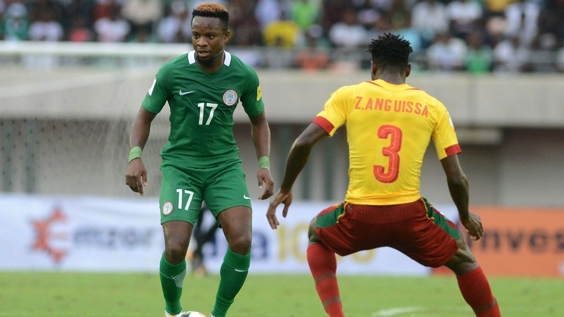 Ogenyi Onazi of Nigeria challenges Zambo Andre of Cameroon.
