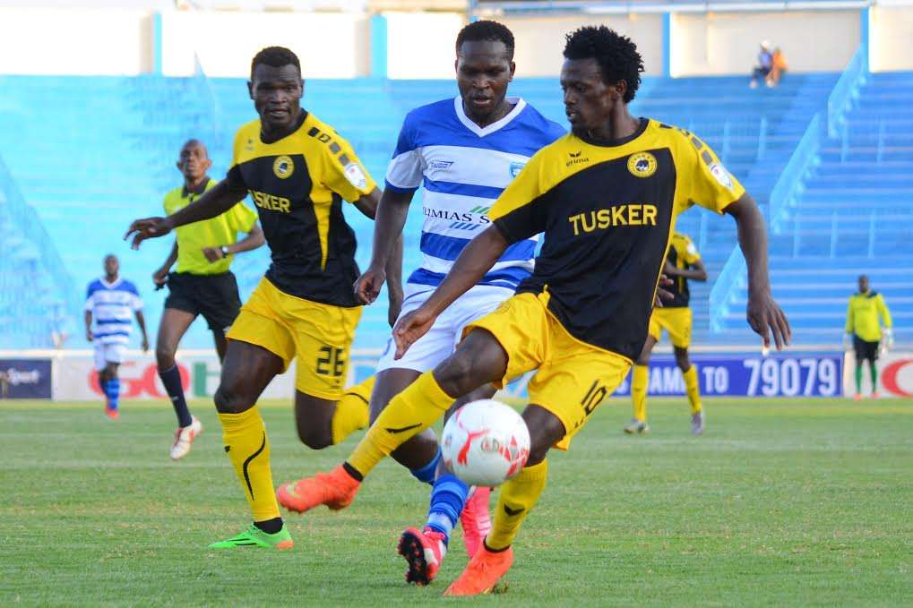 Tusker FC players Kevin Kimani and Noah Wafula against Jackson Saleh of AFC Leopards