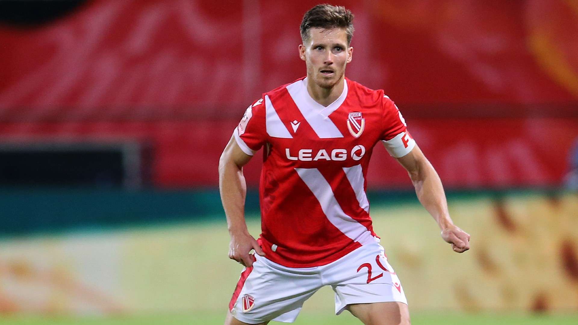 Axel Borgmann of Cottbus runs with the bal