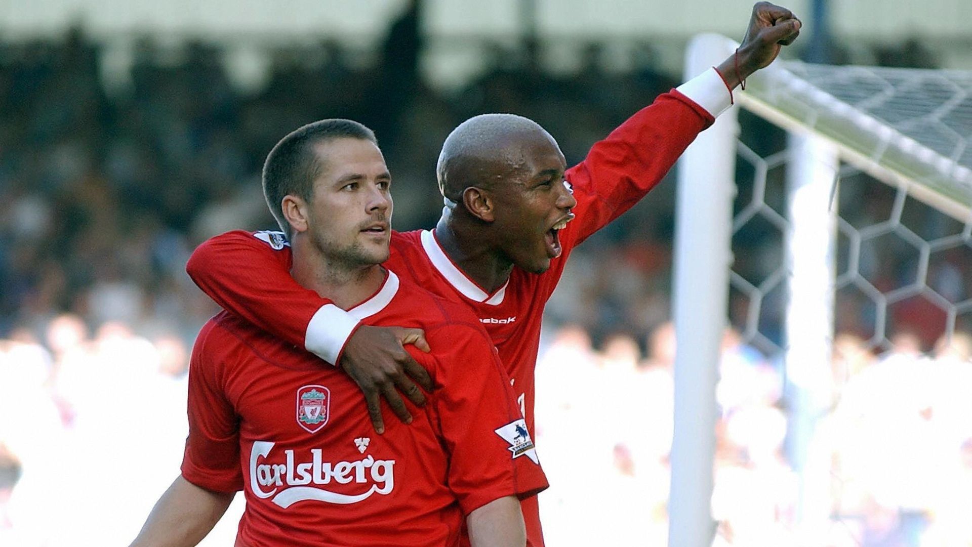 Michael Owen and El Hadji Diouf of Liverpool