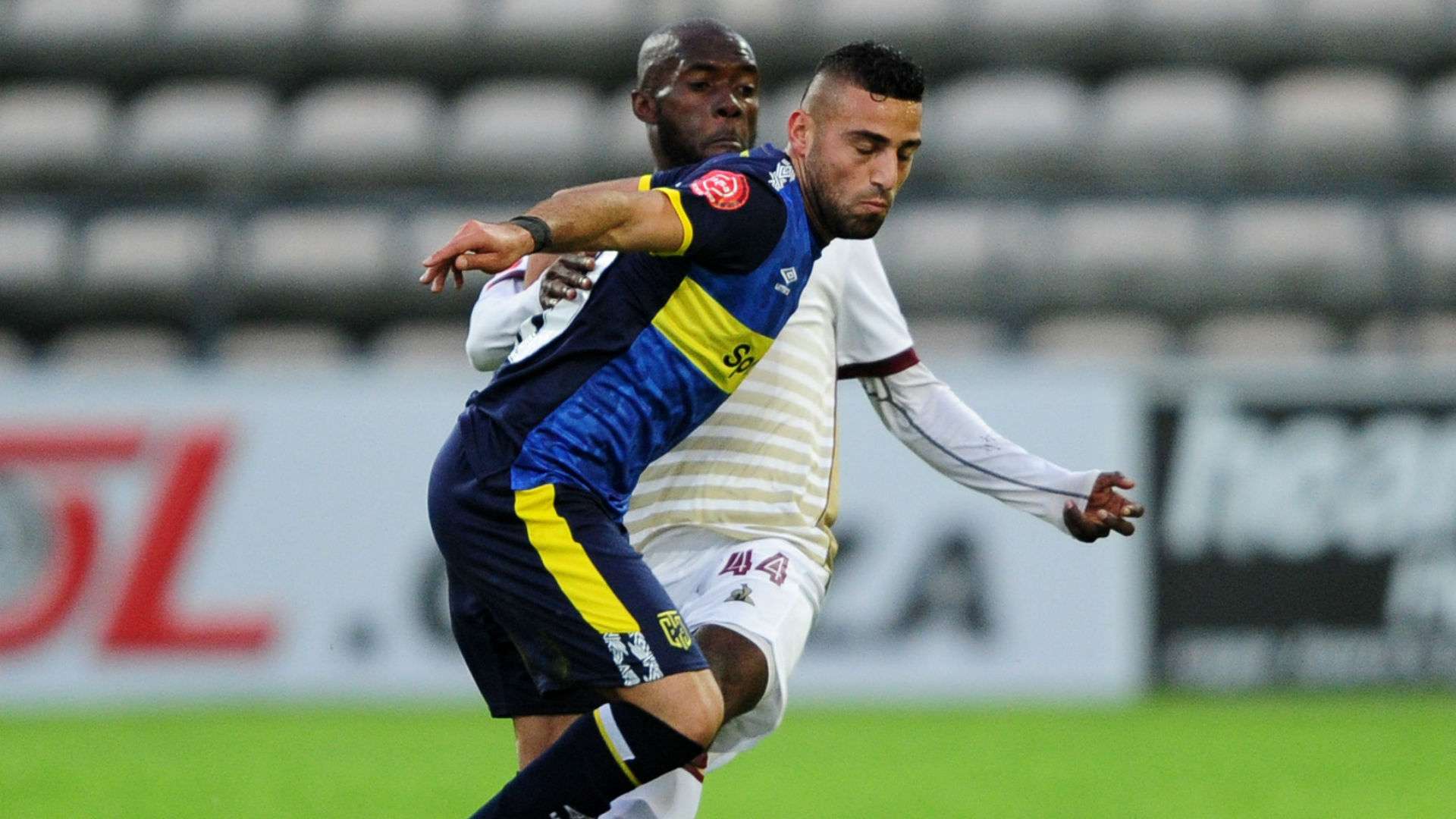 Christopher David of Cape Town City is challenged by Junior Awono of Stellenbosch FC, August 2019