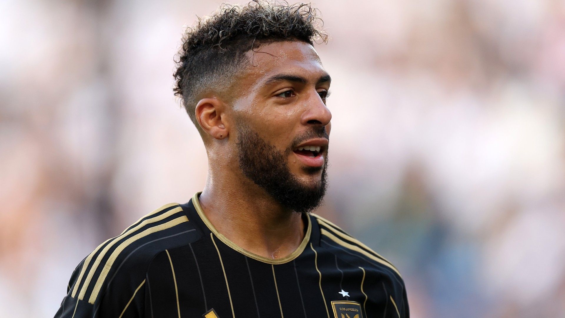  Denis Bouanga #99 of Los Angeles Football Club looks on 