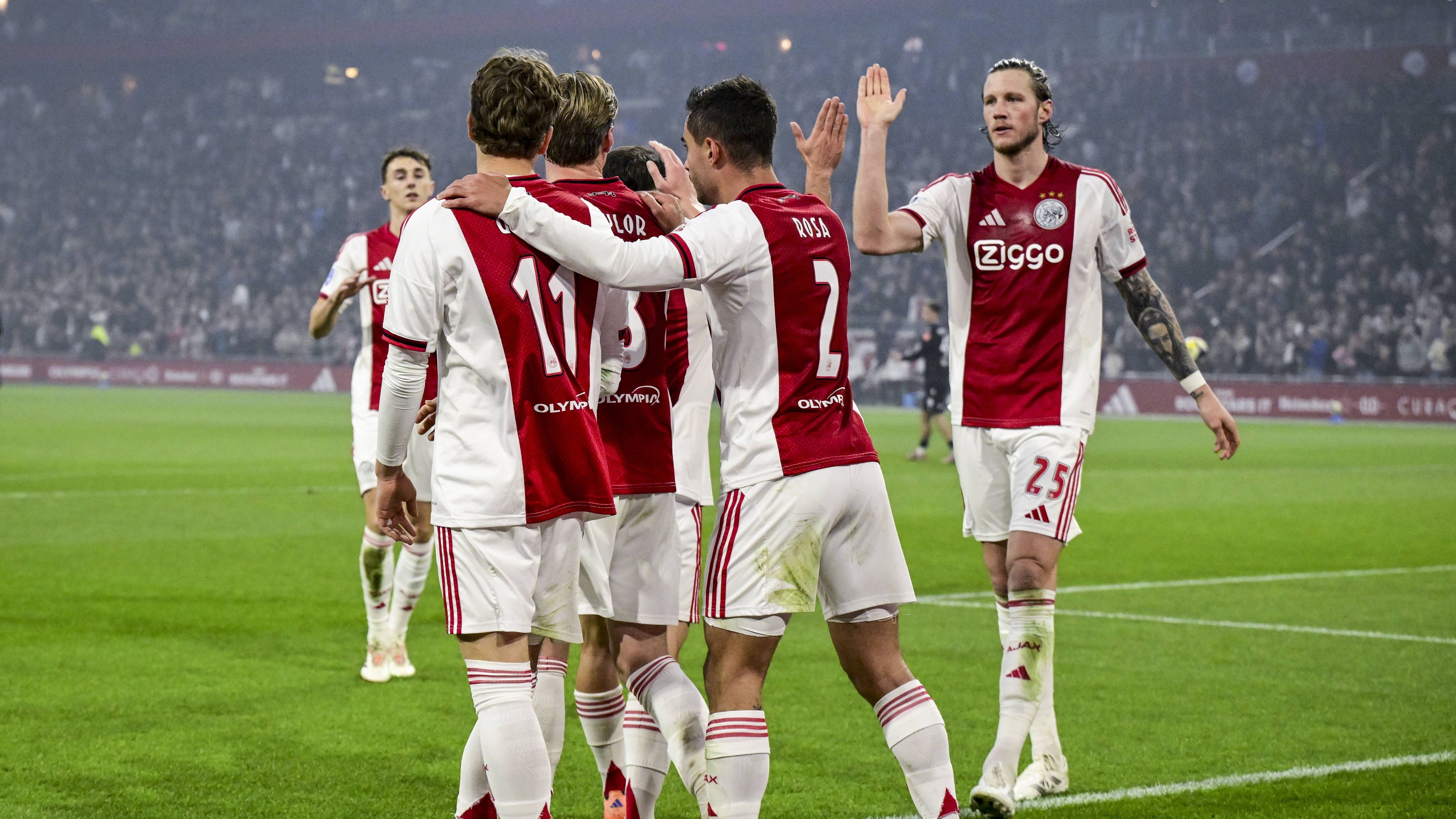 AMSTERDAM - Mika Godts of Ajax, Kenneth Taylor of Ajax, Lucas Rosa of Ajax, and Wout Weghorst of Ajax celebrate the 1-0 goal scored by Mika Godts of Ajax during the Dutch Eredivisie match between AFC Ajax and SC Heerenveen at the Johan Cruijff ArenA on November 1, 2025, in Amsterdam, Netherlands. ANP OLAF KRAAK Eredivisie 2025-2026 xVIxANPxSportx xxANPxIVx 540923988 originalFilename: 540923988.jpg