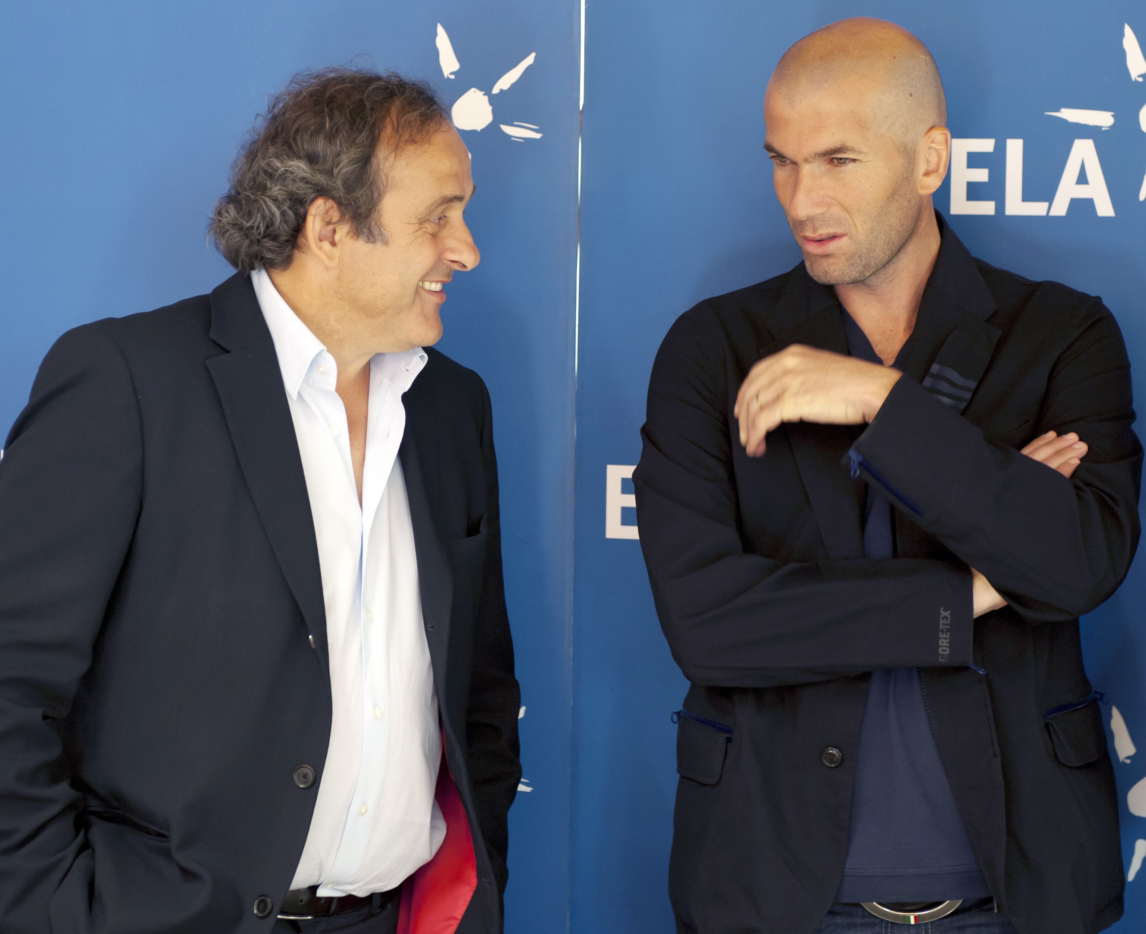 Former French footballers Michel Platini and Zinedine Zidane