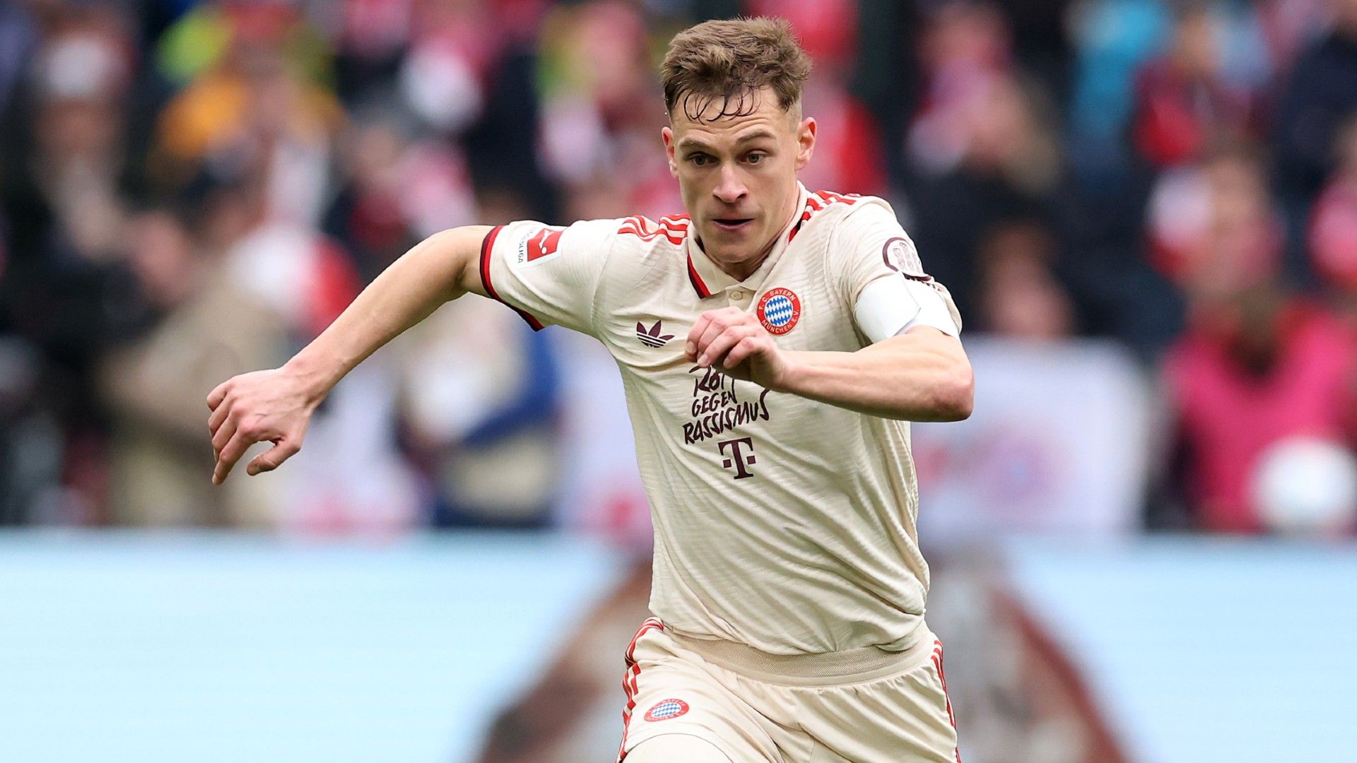 Joshua Kimmich of FC Bayern München runs with the ball 