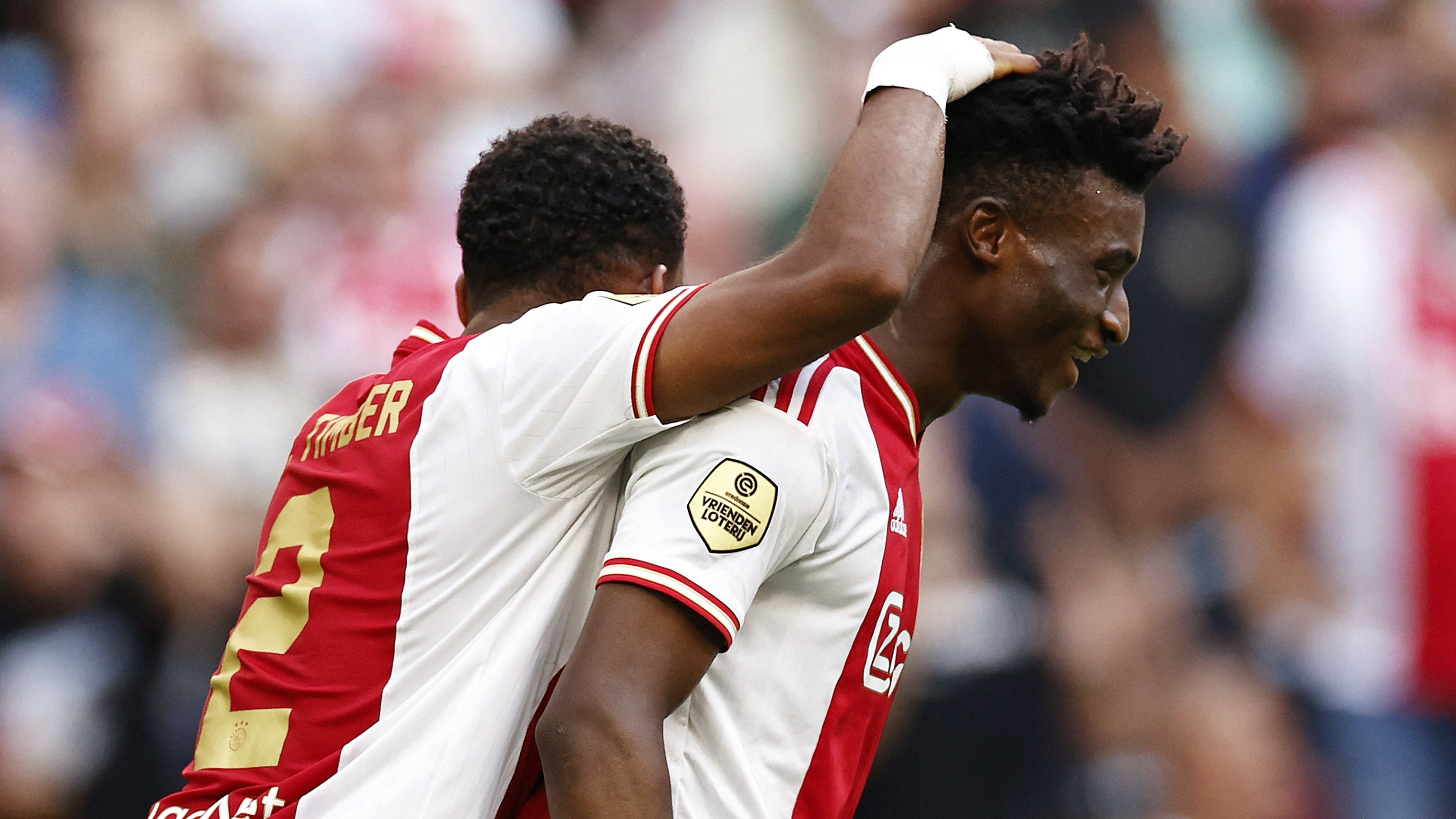 Ajax Jurrien Timber (L) and teammate Mohammed Kudus 