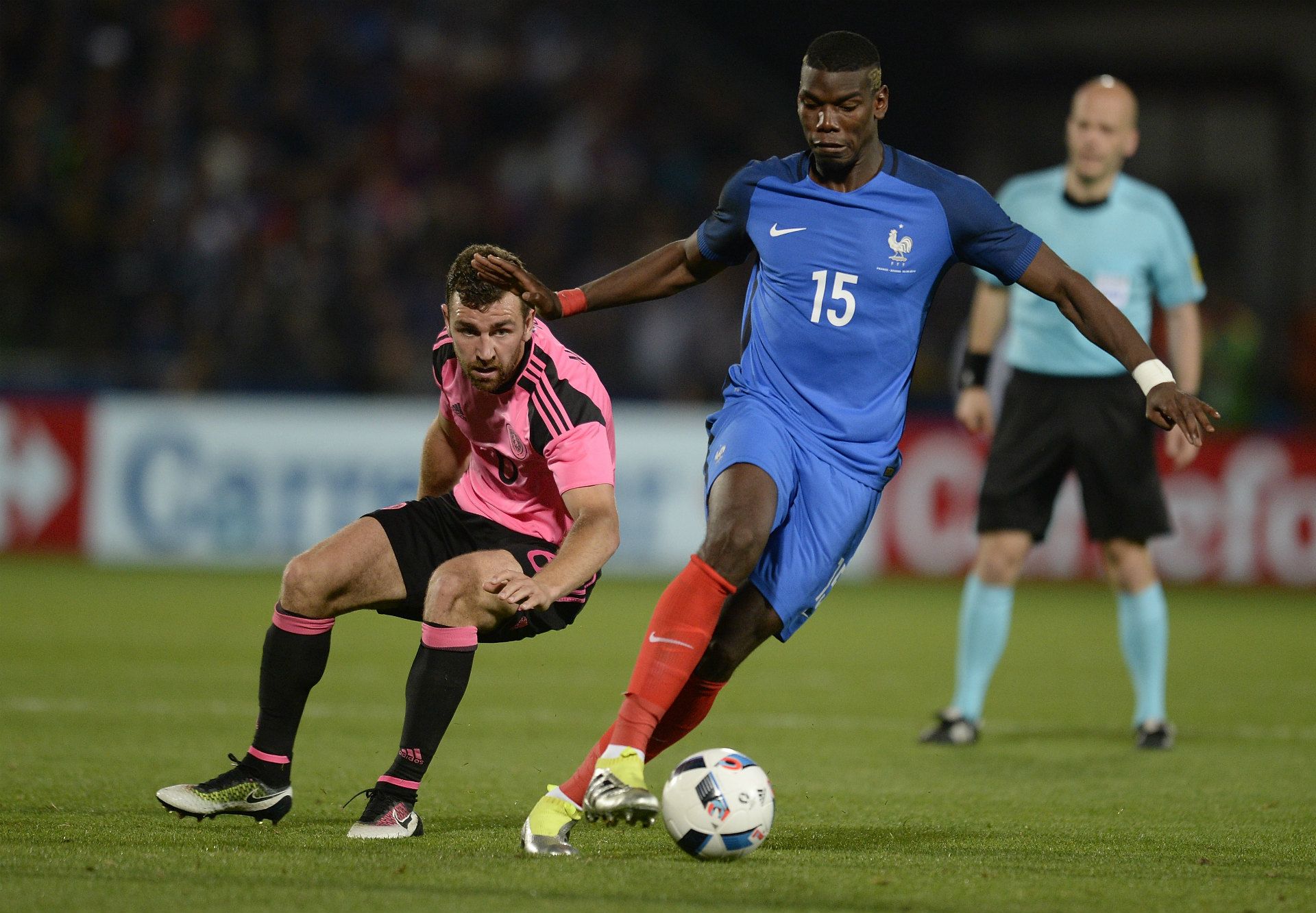 Paul Pogba dribbling for France against Scotland