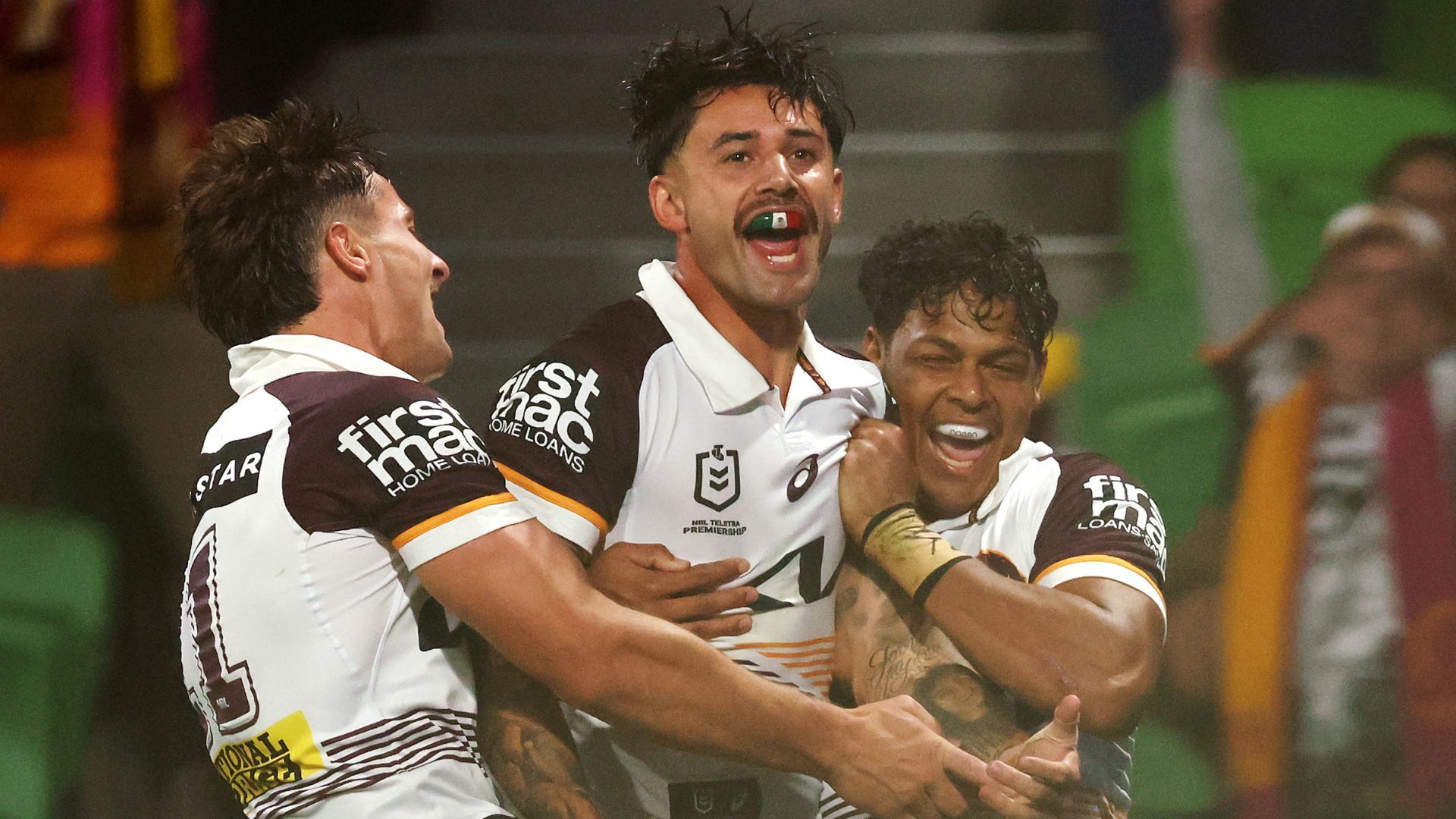 Jesse Arthars (C) of the Brisbane Broncos