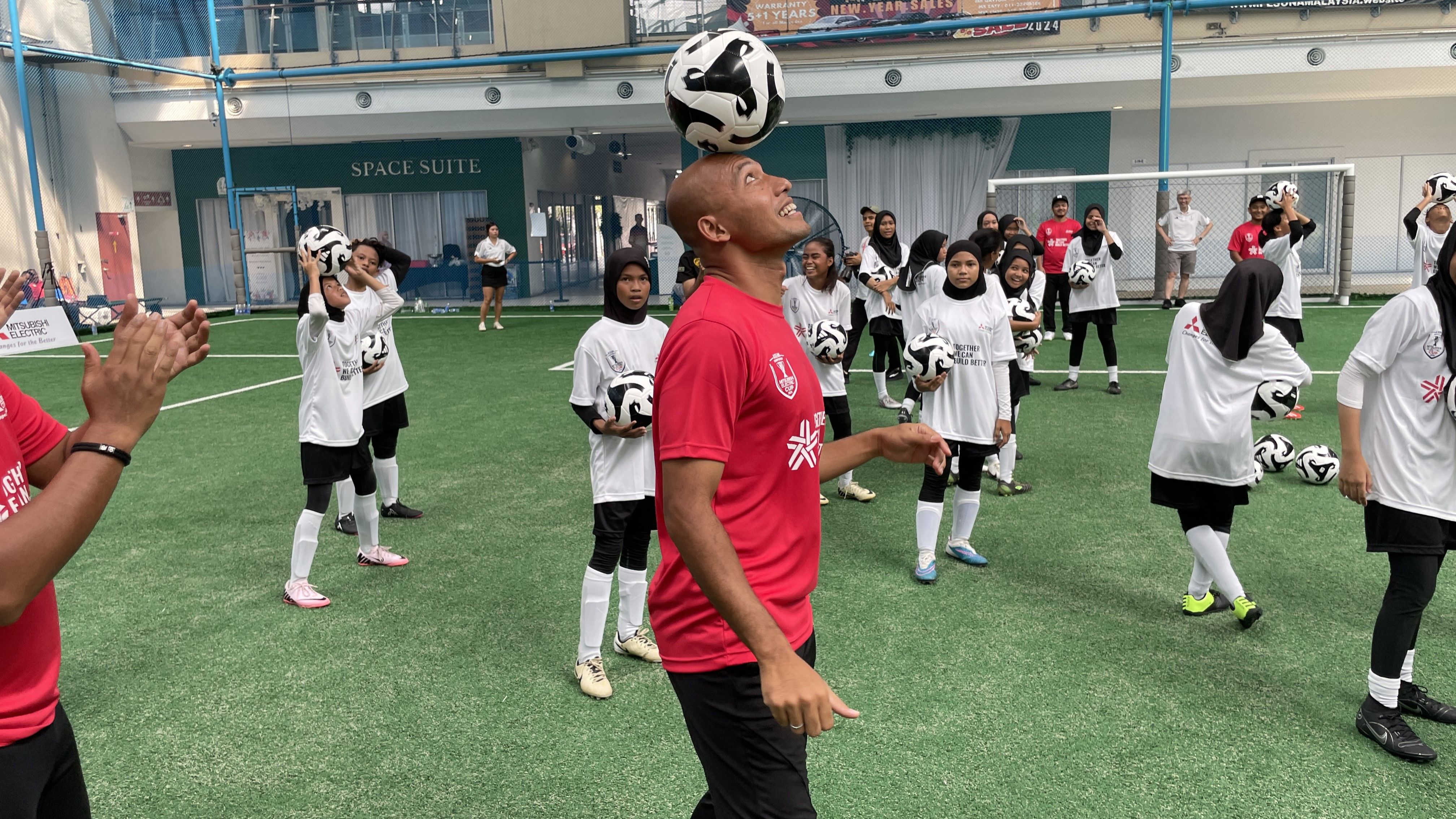Mitsubishi Electric football clinic MY - Mahali Jasuli participating in one of the drills