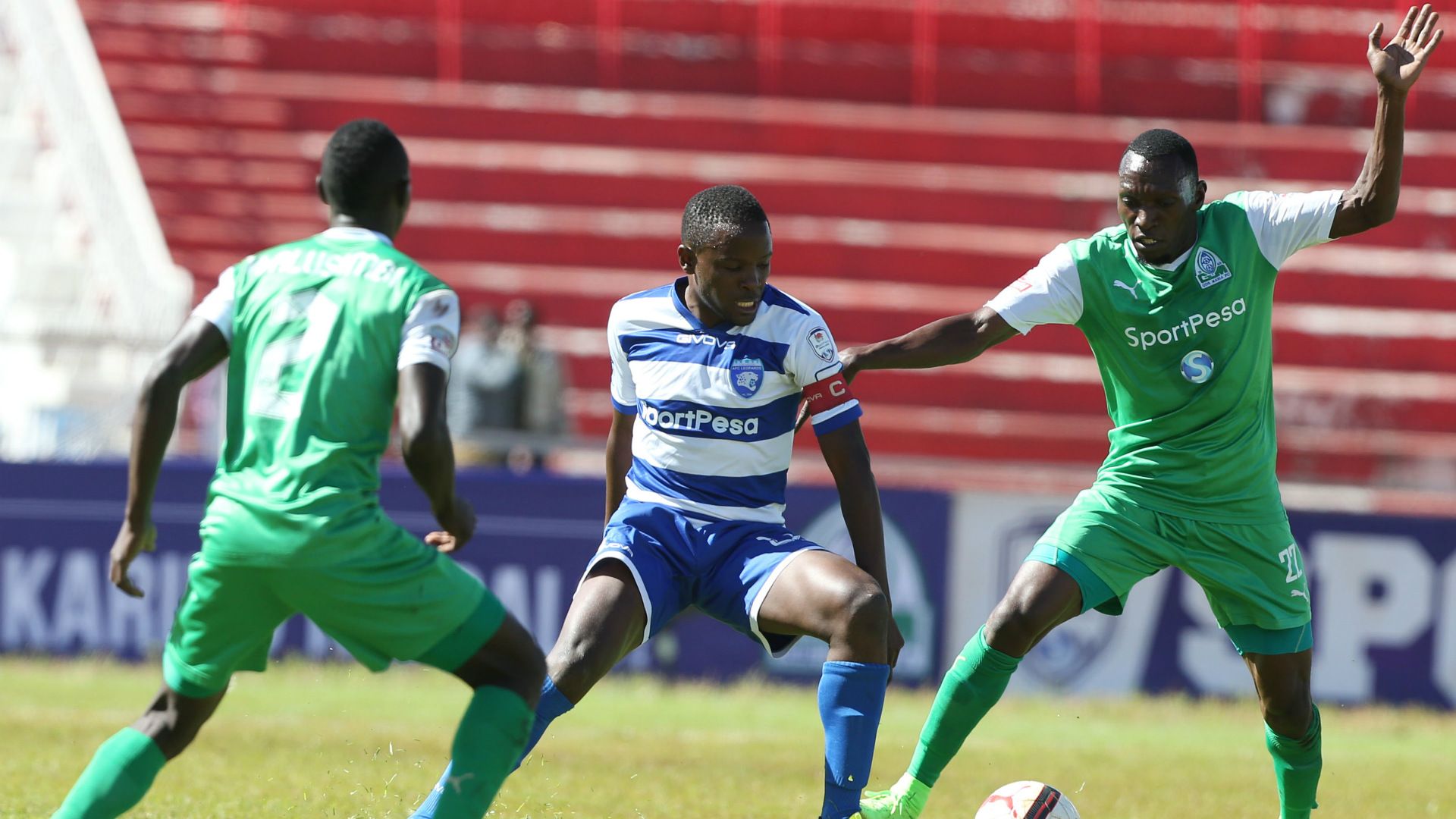 AFC Leopards captain Bernard Mangoli takes on Meddie Kagere and Goddfrey Walusimbi of Gor Mahia.