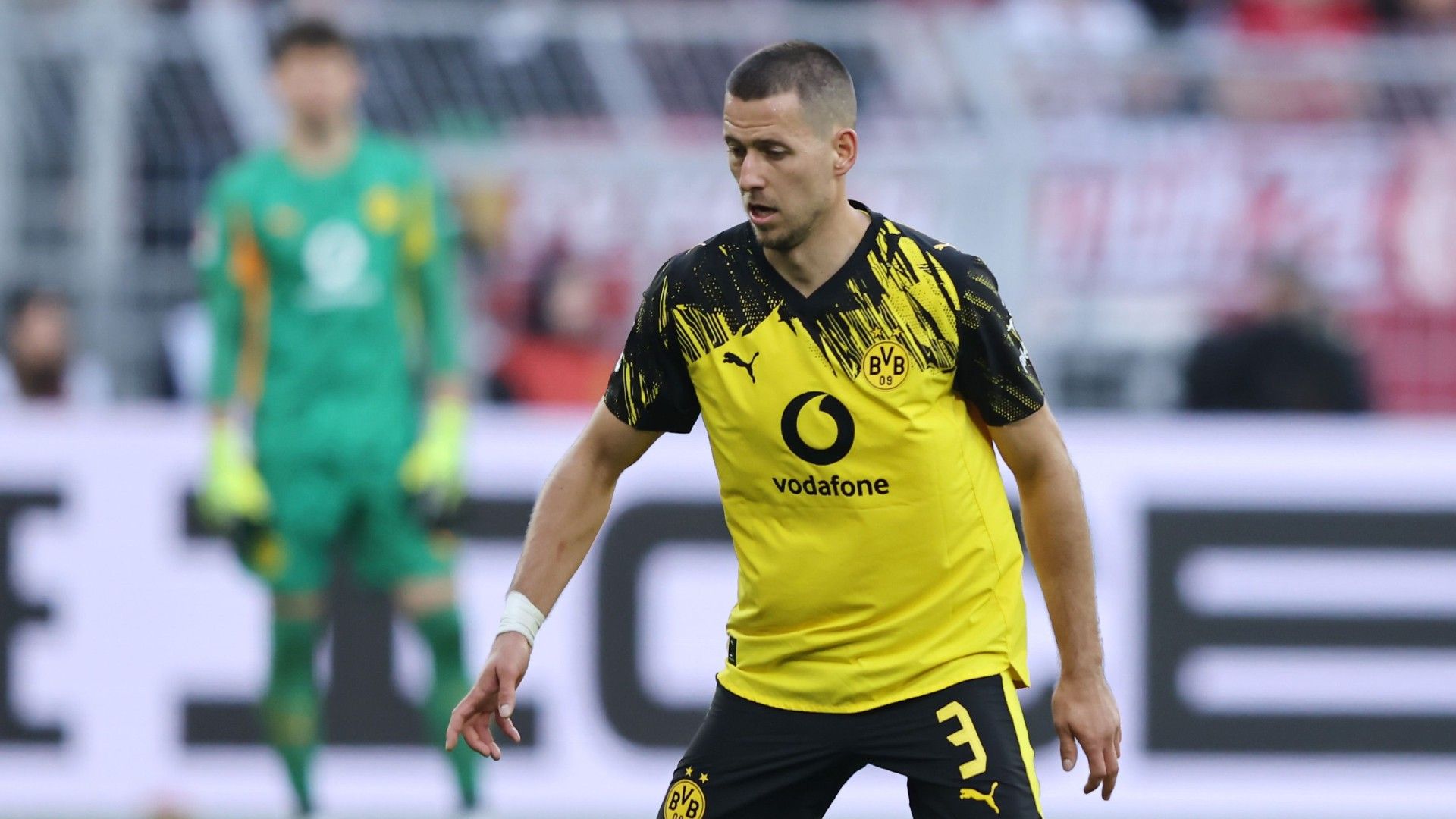 Waldemar Anton of Borussia Dortmund runs with the ball 