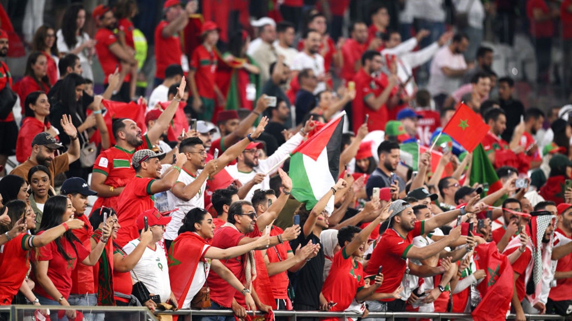 Morocco fans celebrate their team's win.