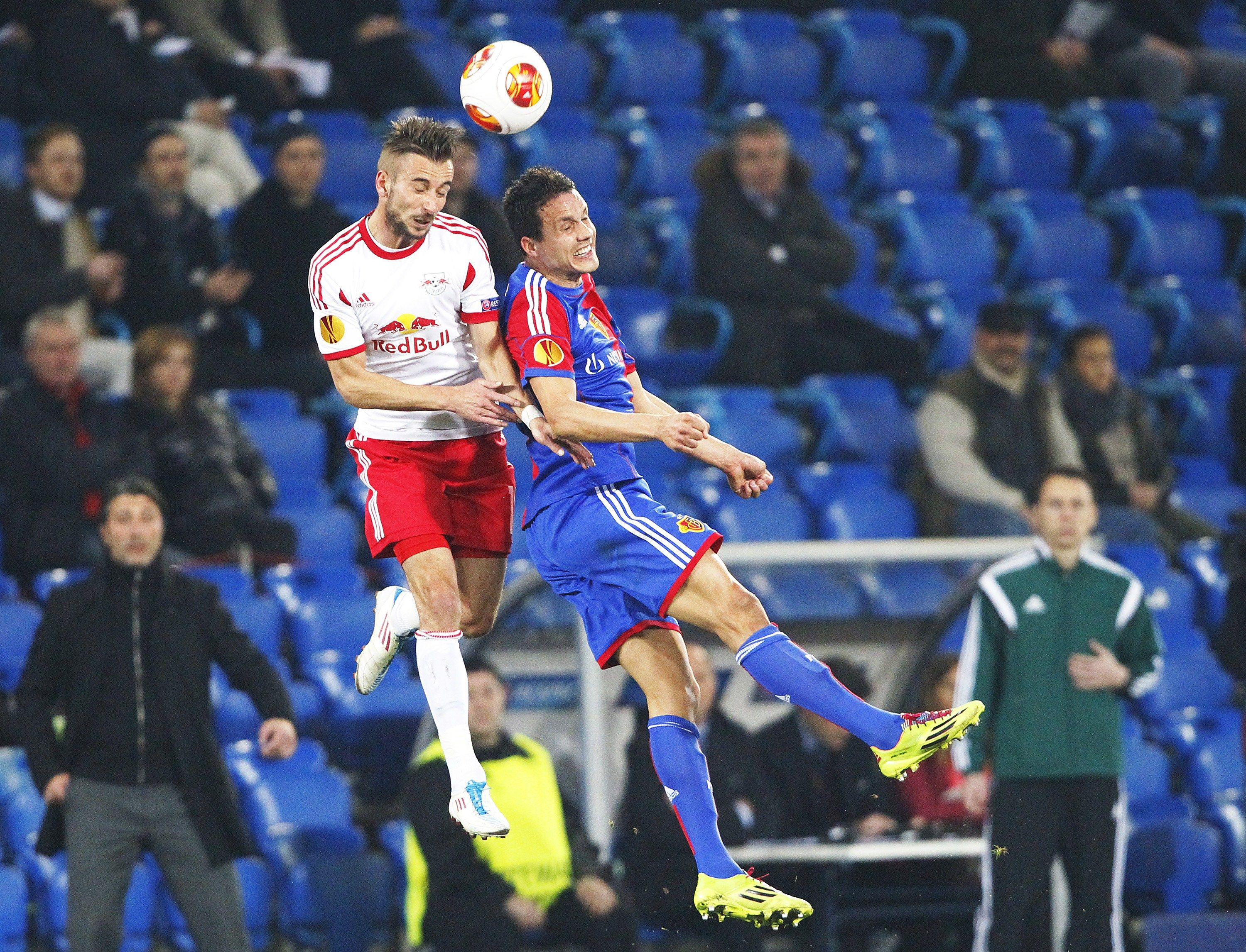 Philipp Degen (R) and Dusan Svento contest a header