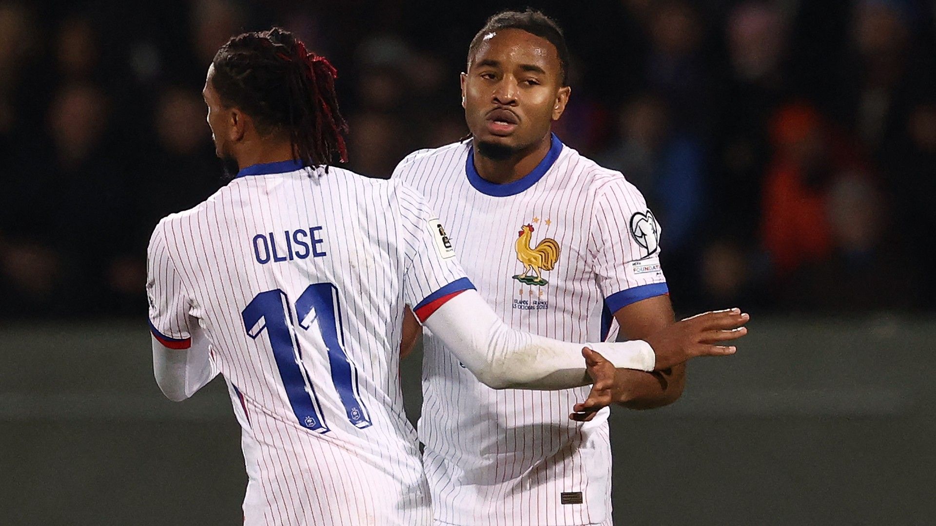 France's forward #18 Christopher Nkunku (R) celebrates scoring