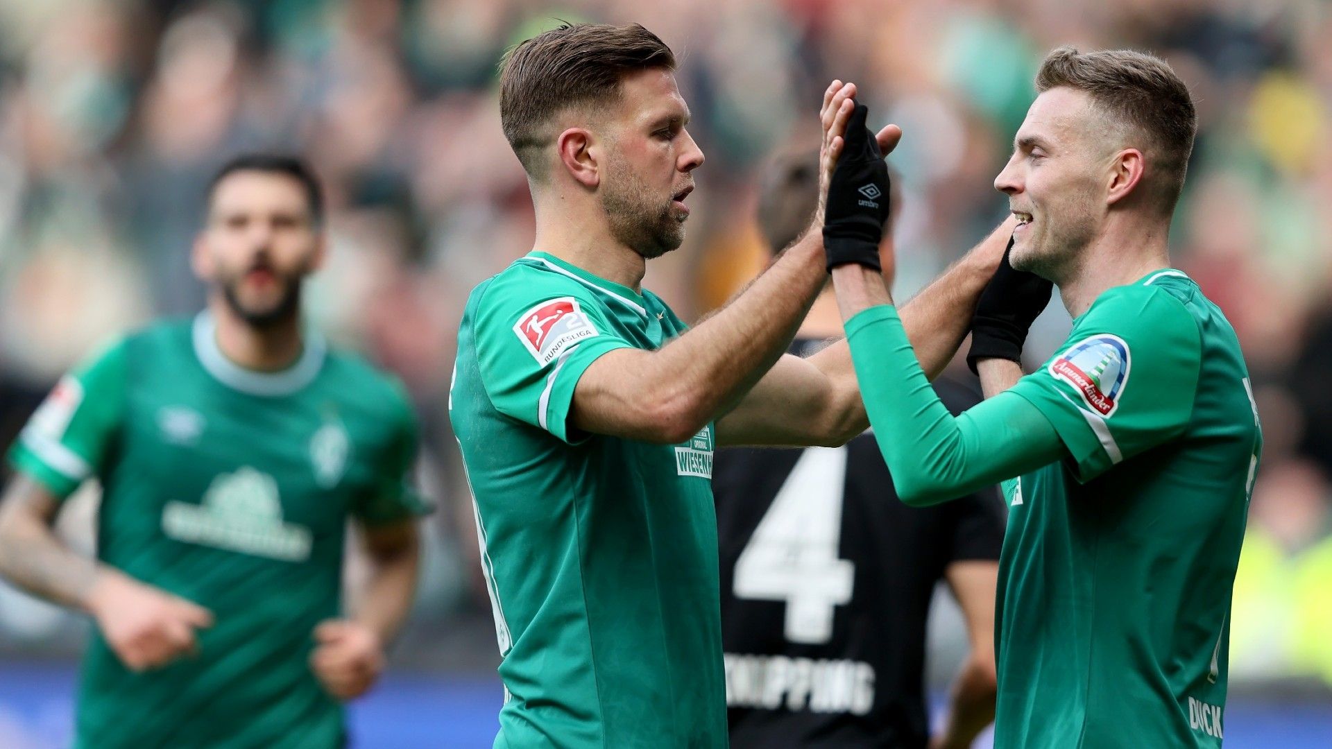 Niclas Füllkrug (L) of SV Werder Bremen celebrate with team mate Marvin Ducksch