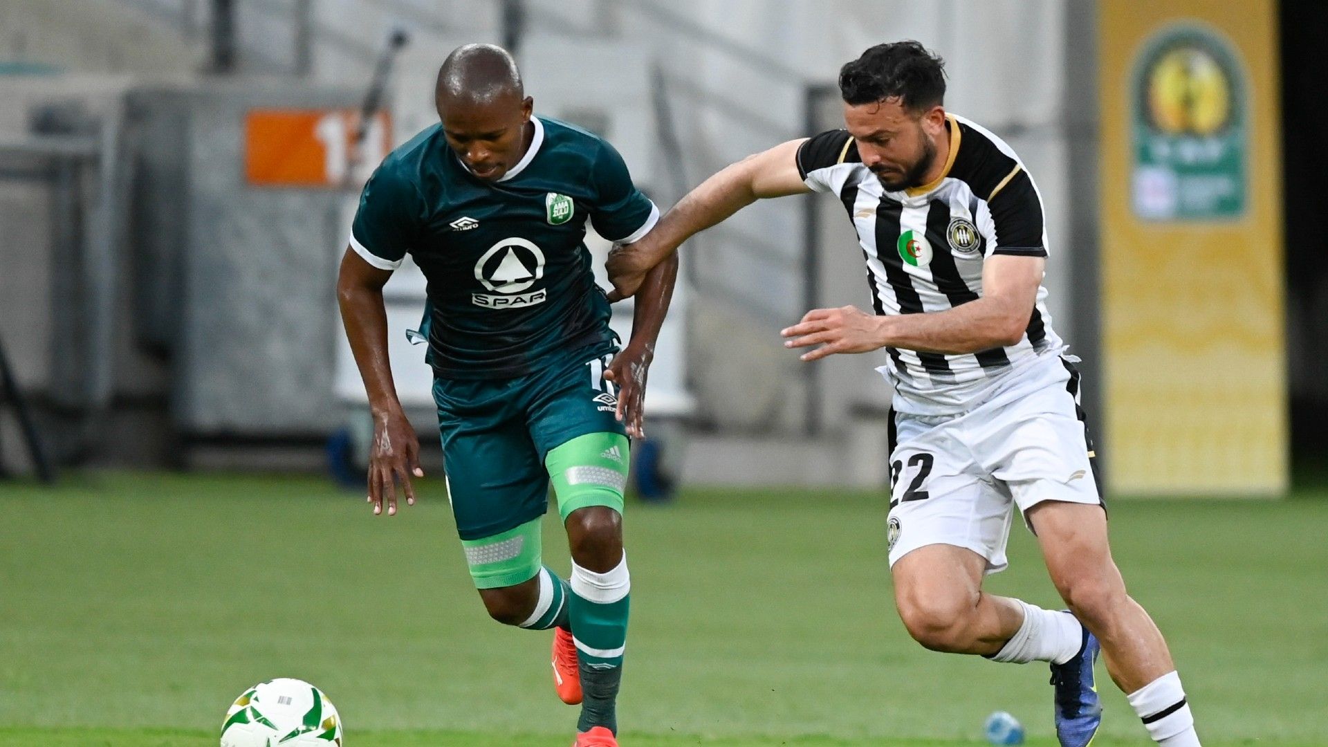 Belkacem Brahimi of ES Setif challenges Luvuyo Memela of AmaZulu FC, February 2022