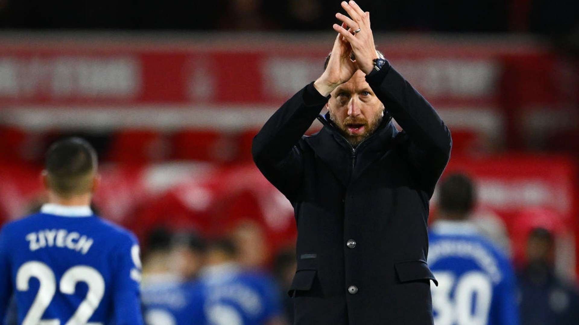 Graham Potter applauds fans.