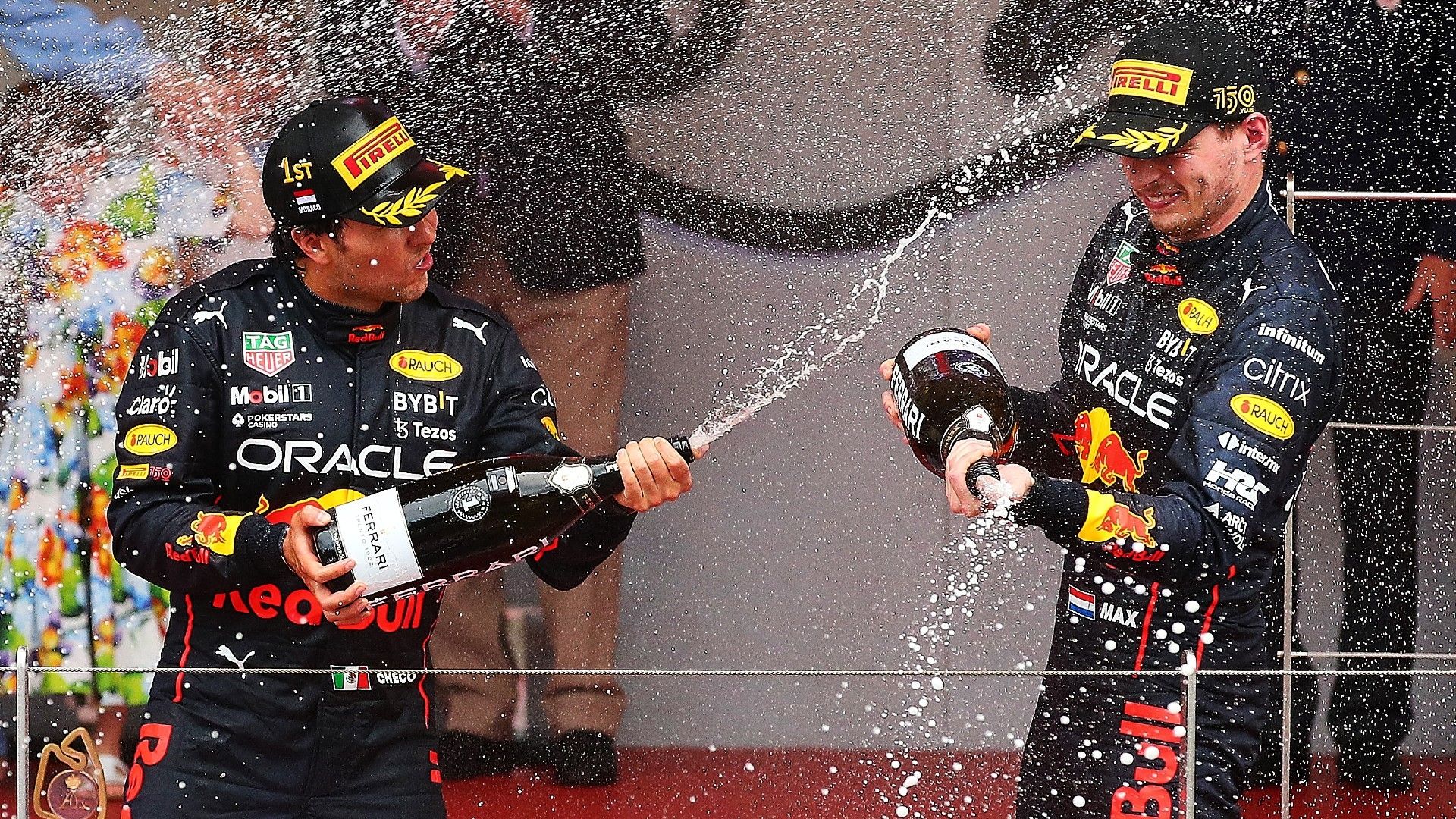 Race winner Sergio Perez of Mexico and Oracle Red Bull Racing and Third placed Max Verstappen of the Netherlands and Oracle Red Bull Racing
