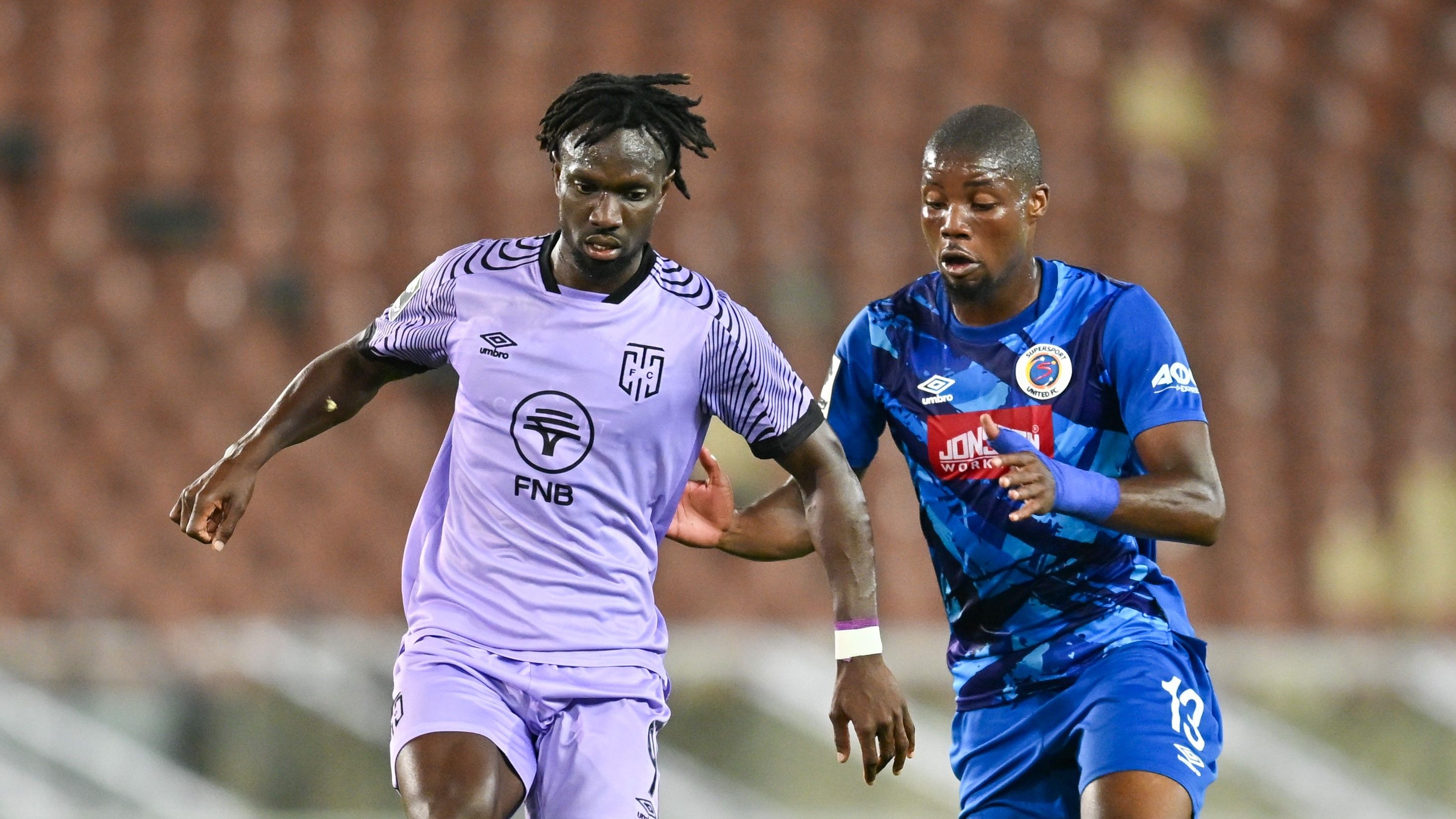 Amadou Soukouna of Cape Town City challenges Ime Okon of SuperSport United