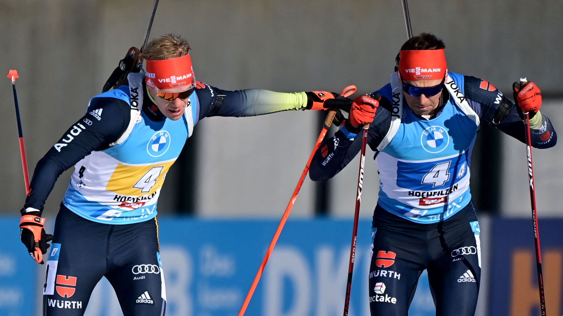 Germany's Roman Rees (L) passes on to Germany's Philipp Nawrath during the men's 4x7,5 km relay event