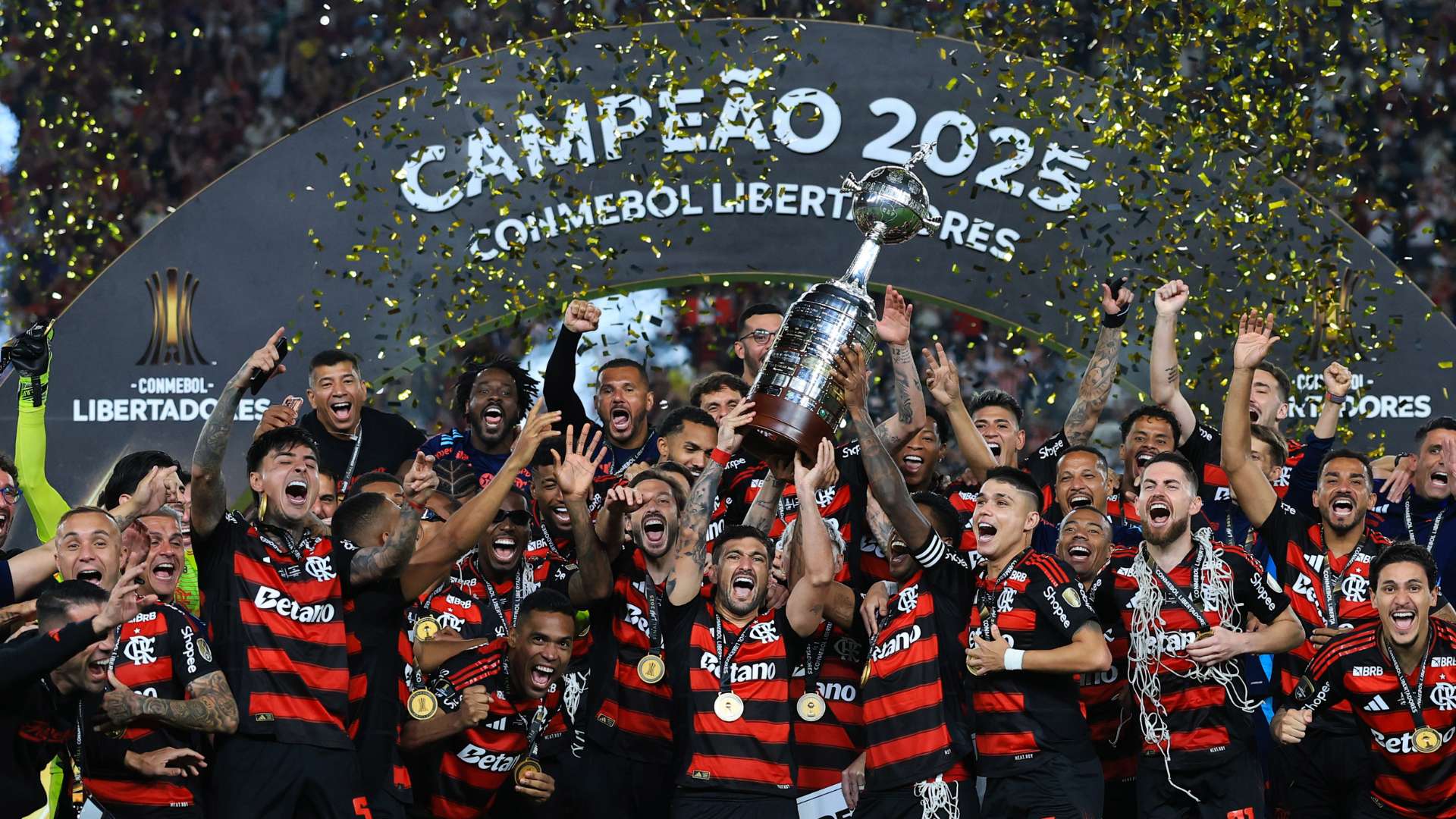 Giorgian de Arrascaeta and Bruno Henrique of Flamengo lift the Champion's trophy after winning the the 2025 Copa CONMEBOL Libertadores Final match