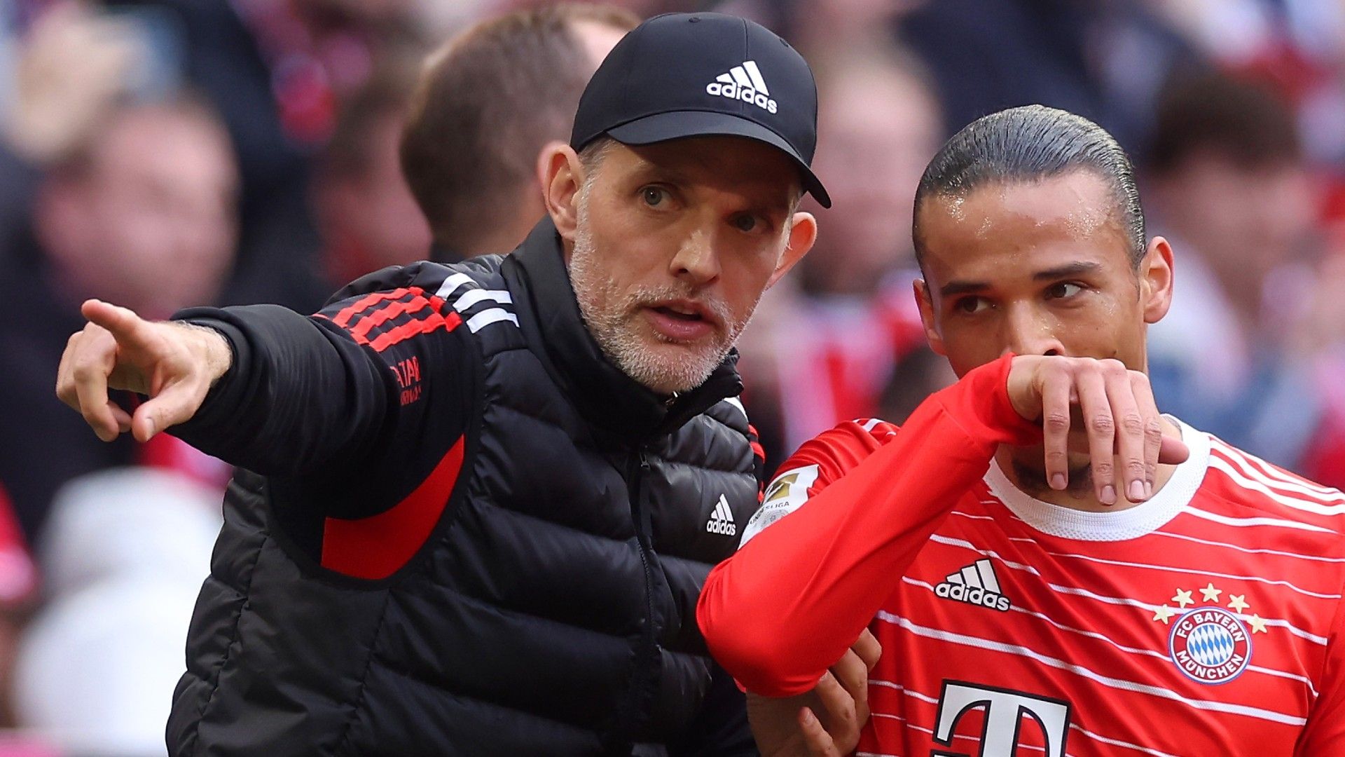 Thomas Tuchel, Head Coach of FC Bayern Munich, gives instructions to Leroy Sane