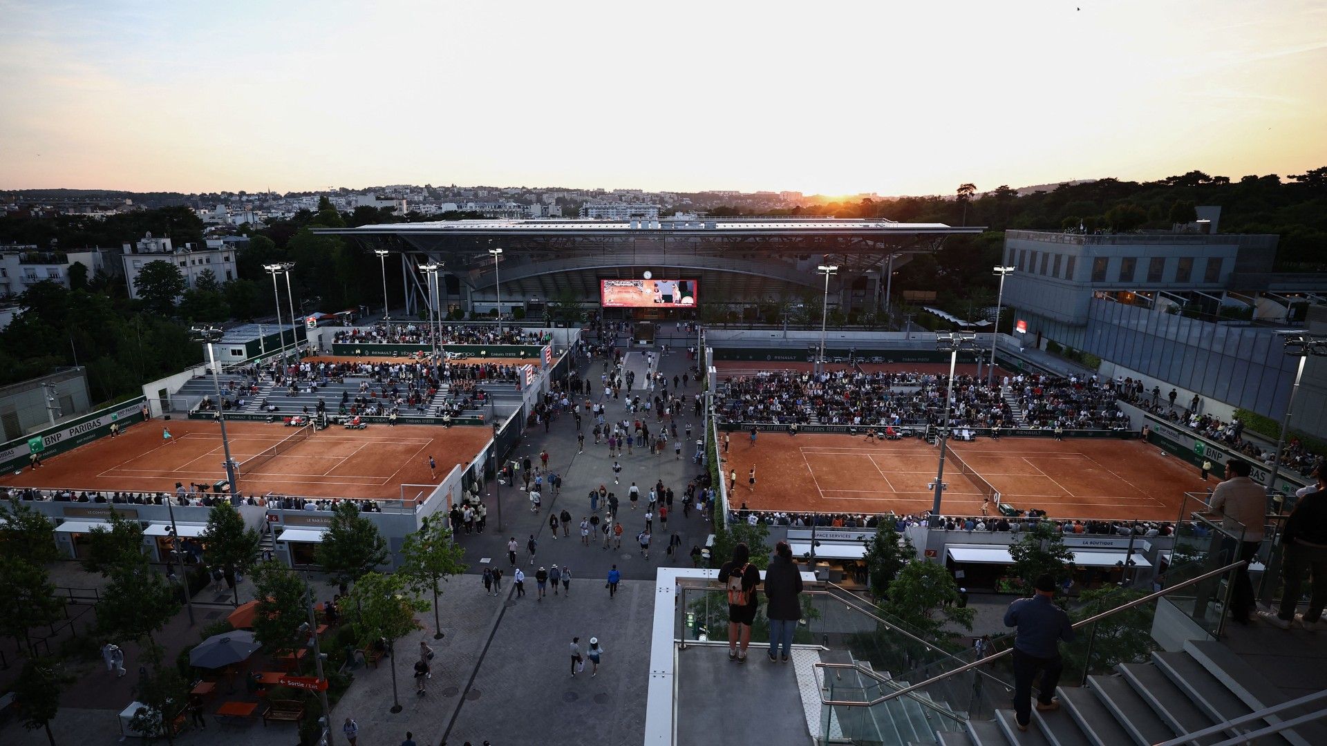 This photograph shows a view of courts and the Suzanne-Lenglen Court (C) on day three of the Roland-Garros Open tennis tournament