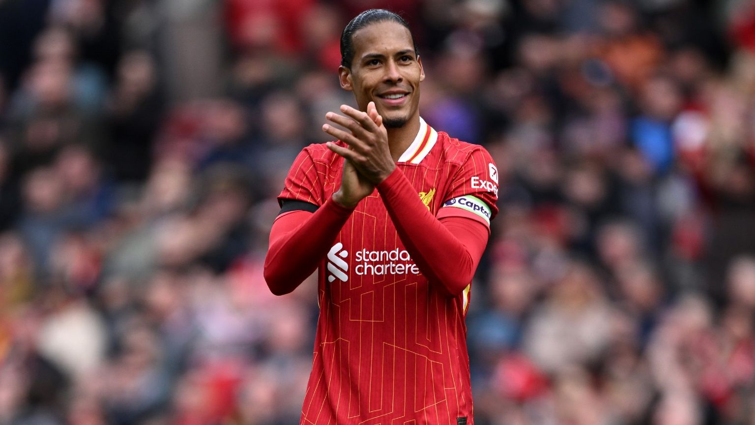   Virgil van Dijk of Liverpool acknowledges the fans 