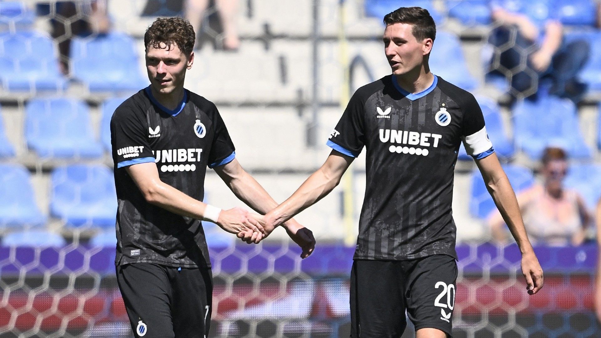Club's Danish midfielder Andreas Skov Olsen (L)and Club's Belgian midfielder #20 Hans Vanaken celebrate 