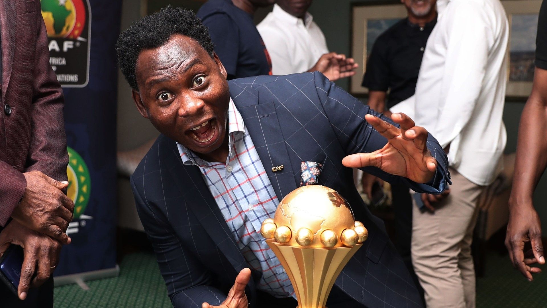Daniel Amokachi with the tournament trophy.
