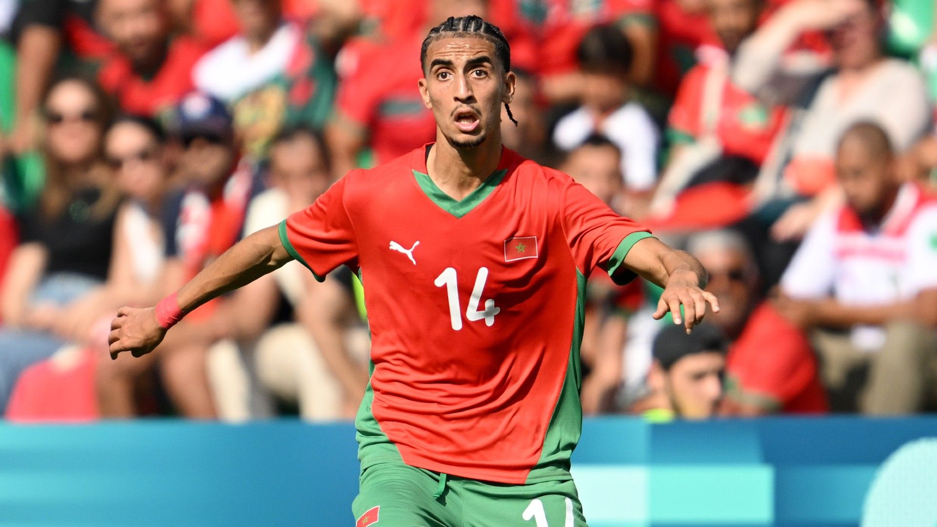 Oussama Targhalline #14 of Team Morocco runs with the ball