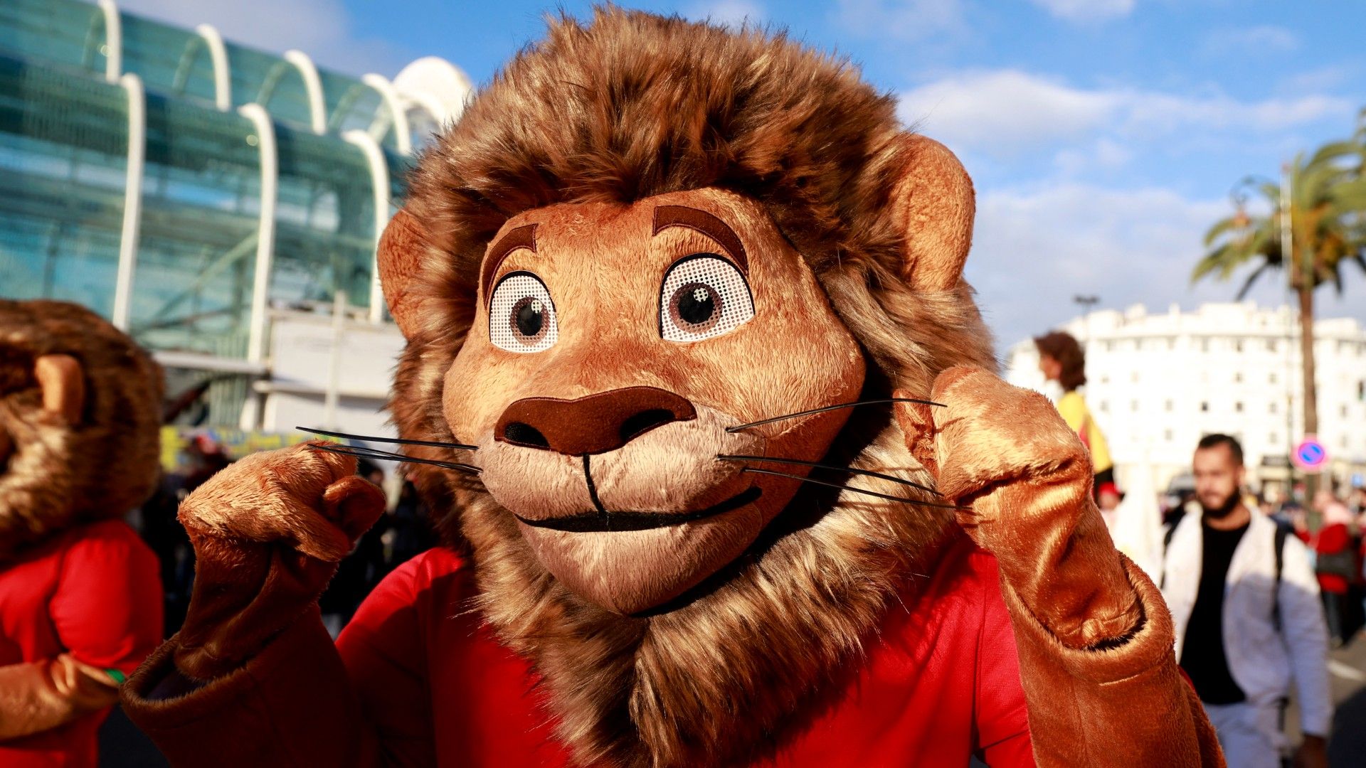 The tournament mascot 'Assad' joins supporters and entertainers