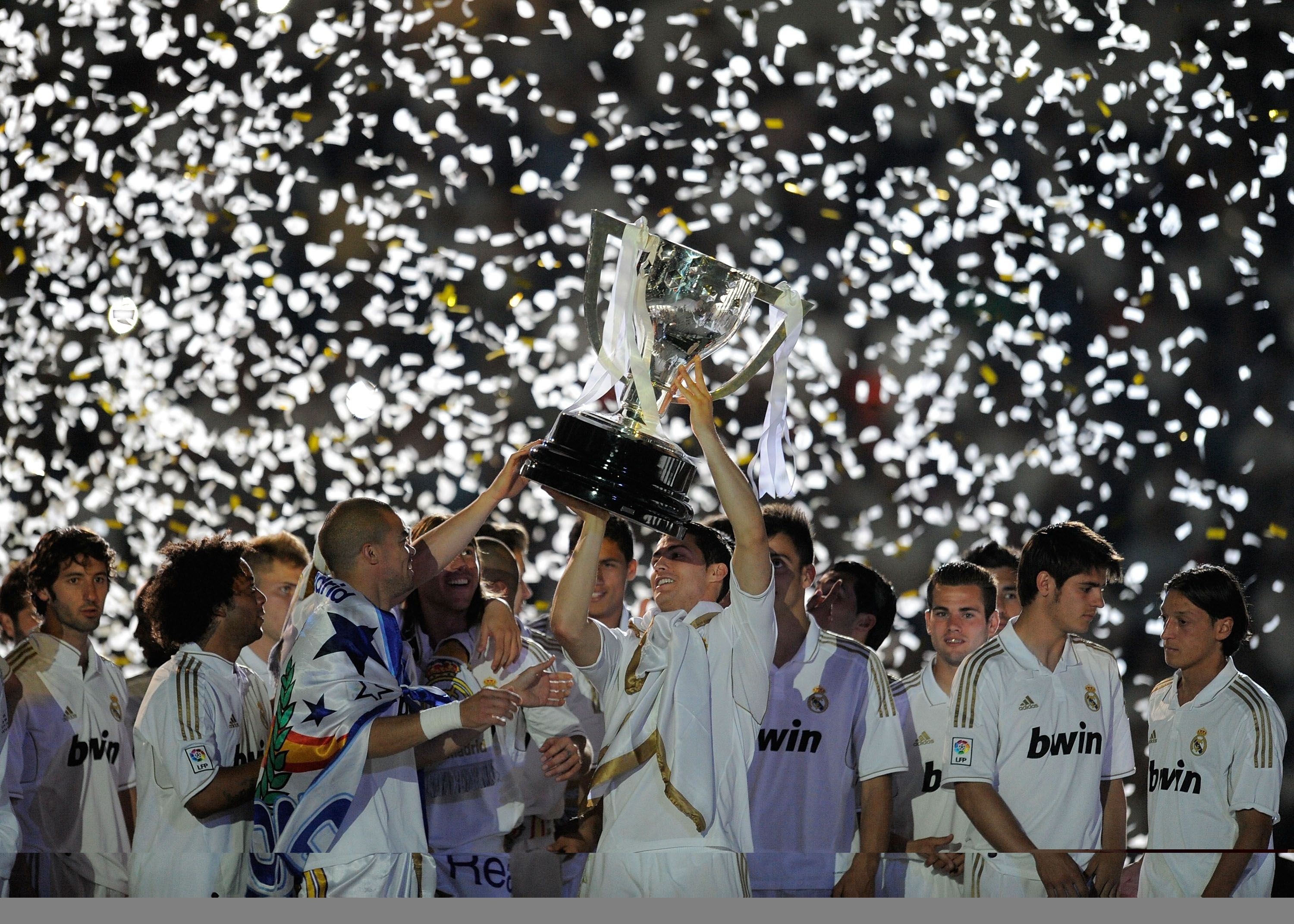 Cristiano Ronaldo of Real Madrid CF holds up the La Liga trophy 2012