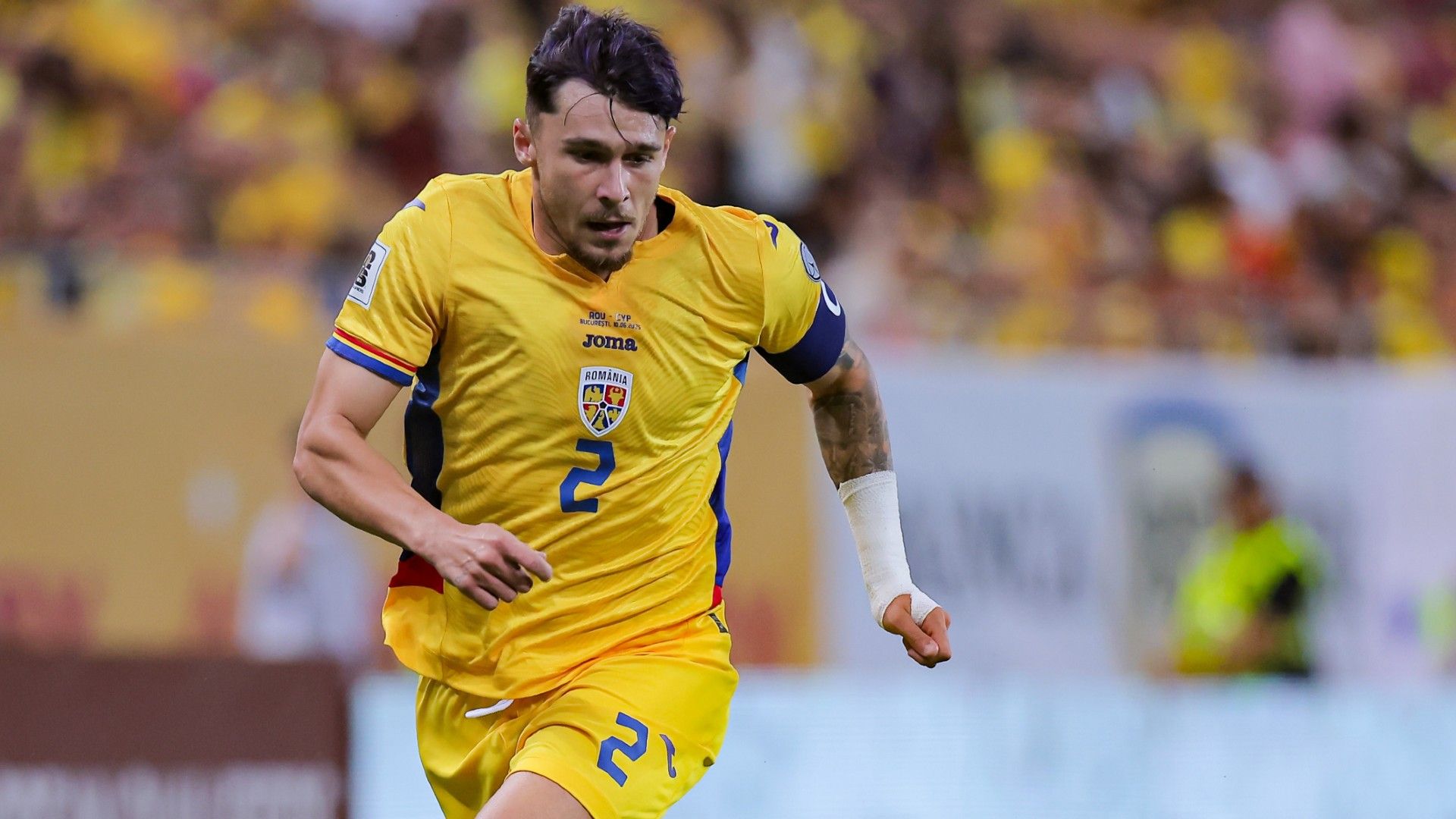 Andrei Ratiu of Romania runs to the ball 