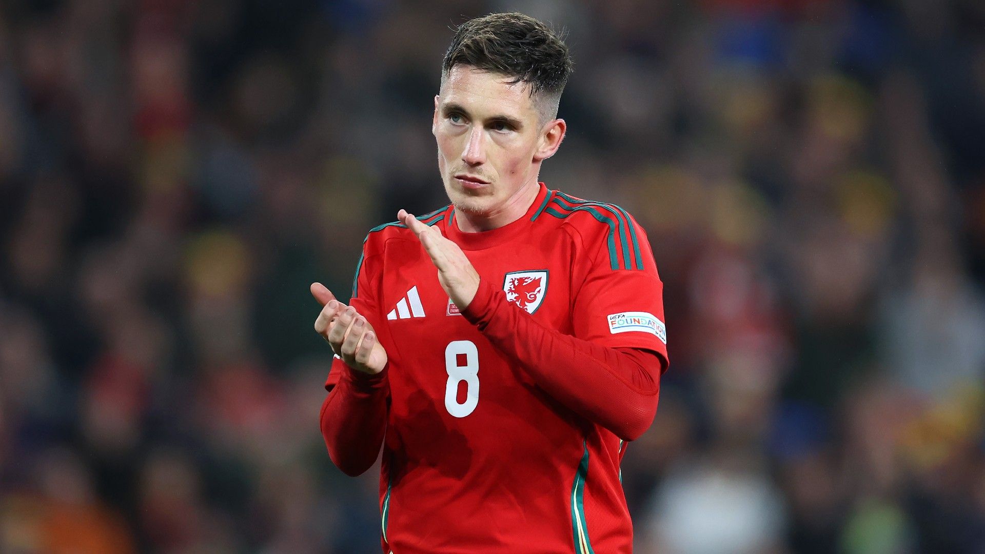  Harry Wilson of Wales applauds the fans