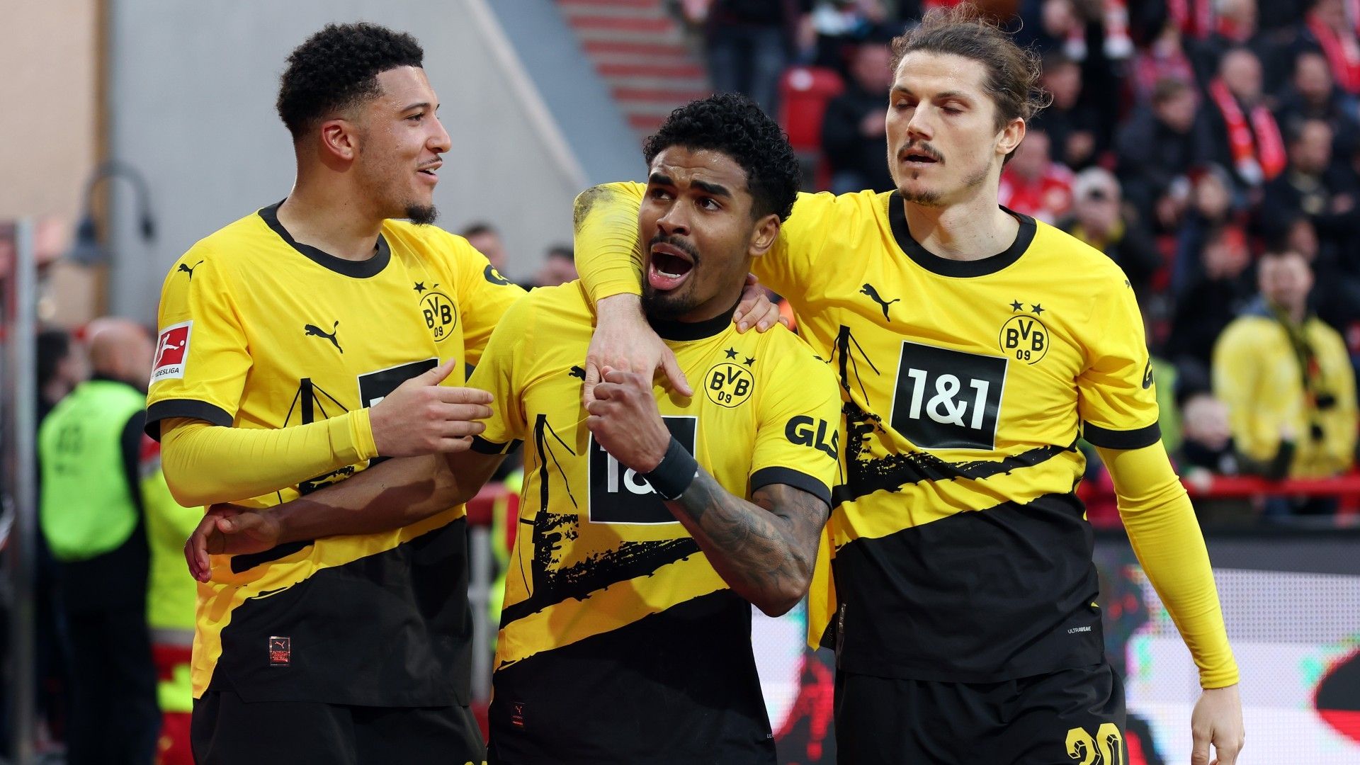 Ian Maatsen of Borussia Dortmund celebrates scoring his team's second goal with teammates Jadon Sancho and Marcel Sabitzer