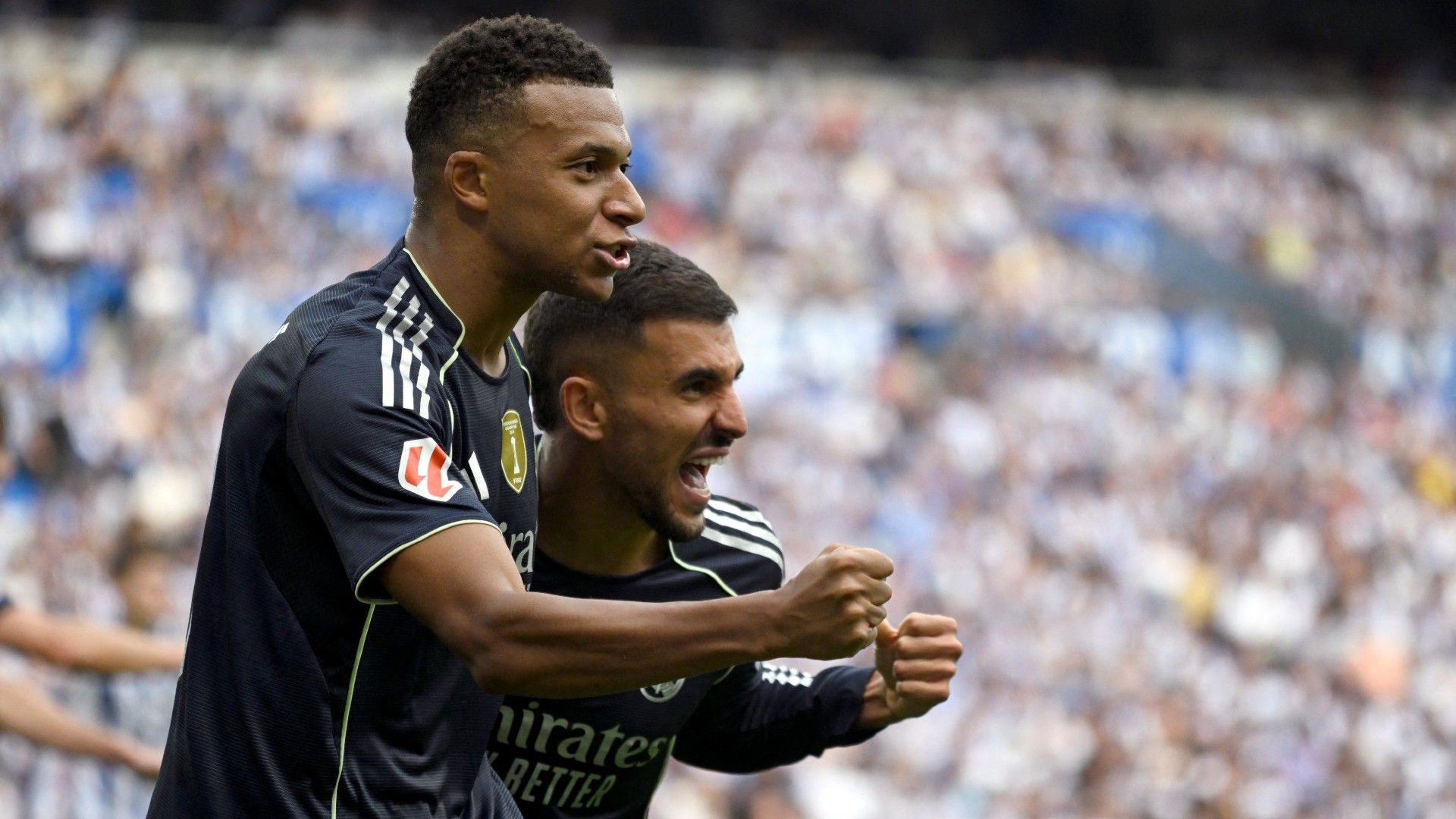 Real Madrid's French forward #10 Kylian Mbappe and Real Madrid's Spanish midfielder #19 Dani Ceballos celebrate