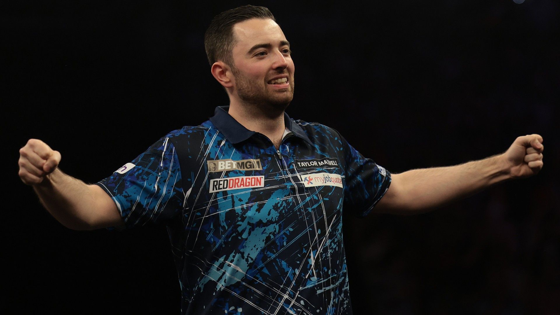 Luke Humphries of England celebrates winning 