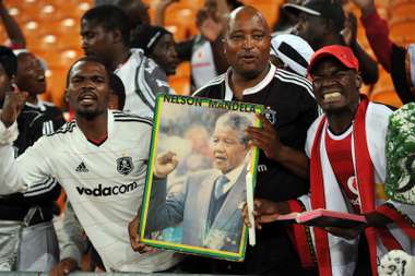 Orlando Pirates fans with Nelson Mandela poster