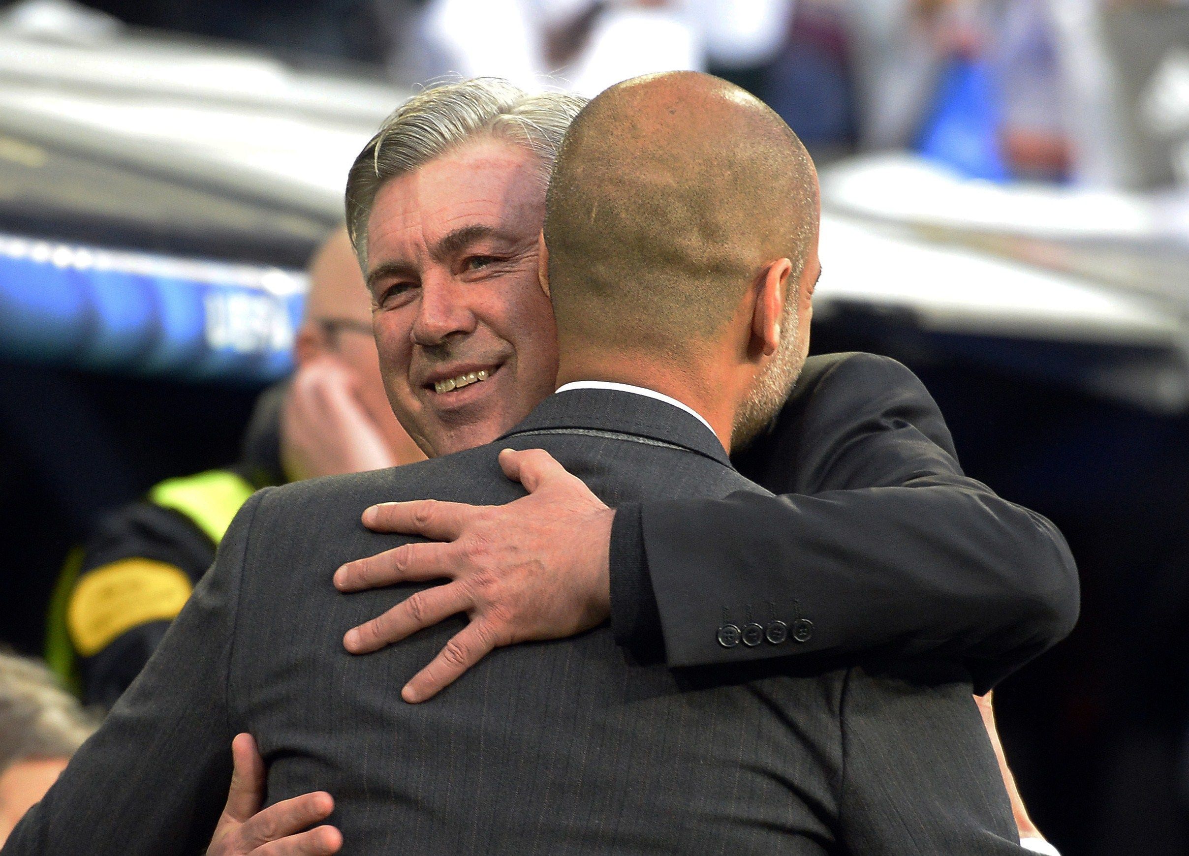 Real Madrid coach Carlo Ancelotti (L) and Bayern's Pep Guardiola