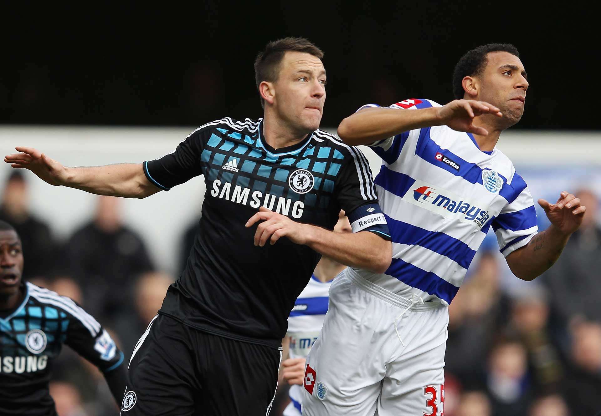 Terry competes for a header with Anton Ferdinand