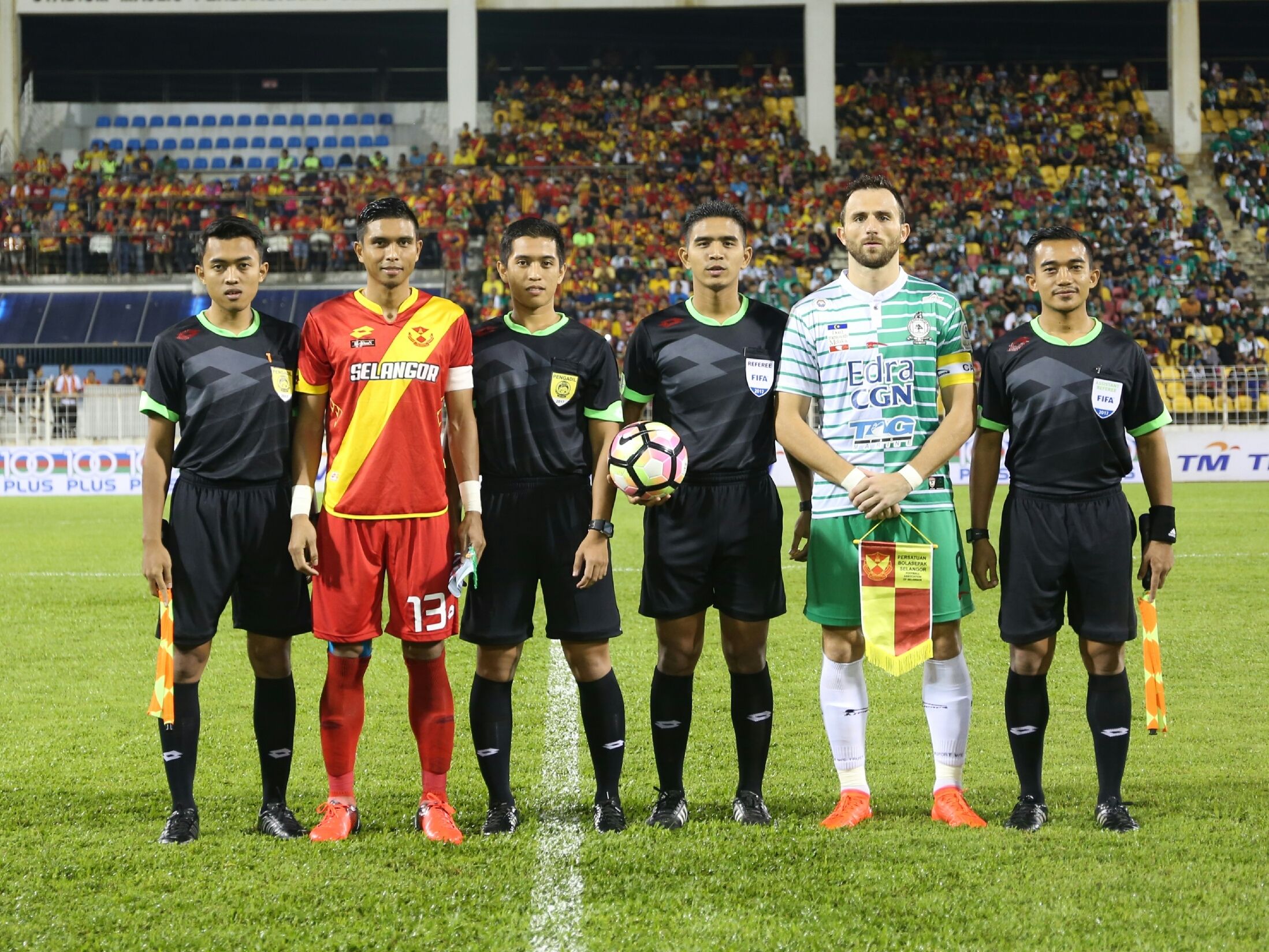 Selangor and Melaka United captain pose for a photo along with the match officials before their league match 27/1/2017