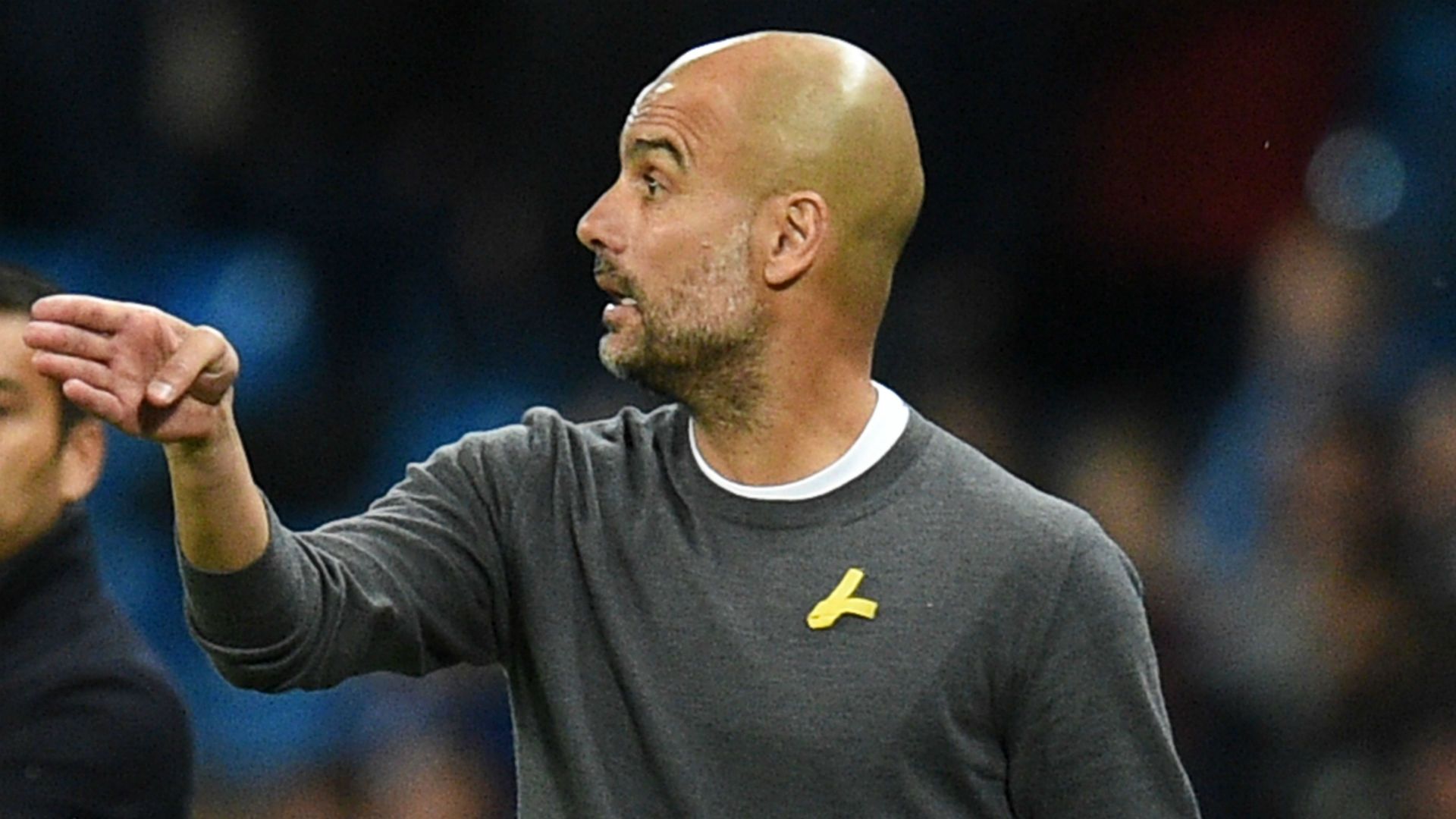 Pep Guardiola Man City yellow ribbon
