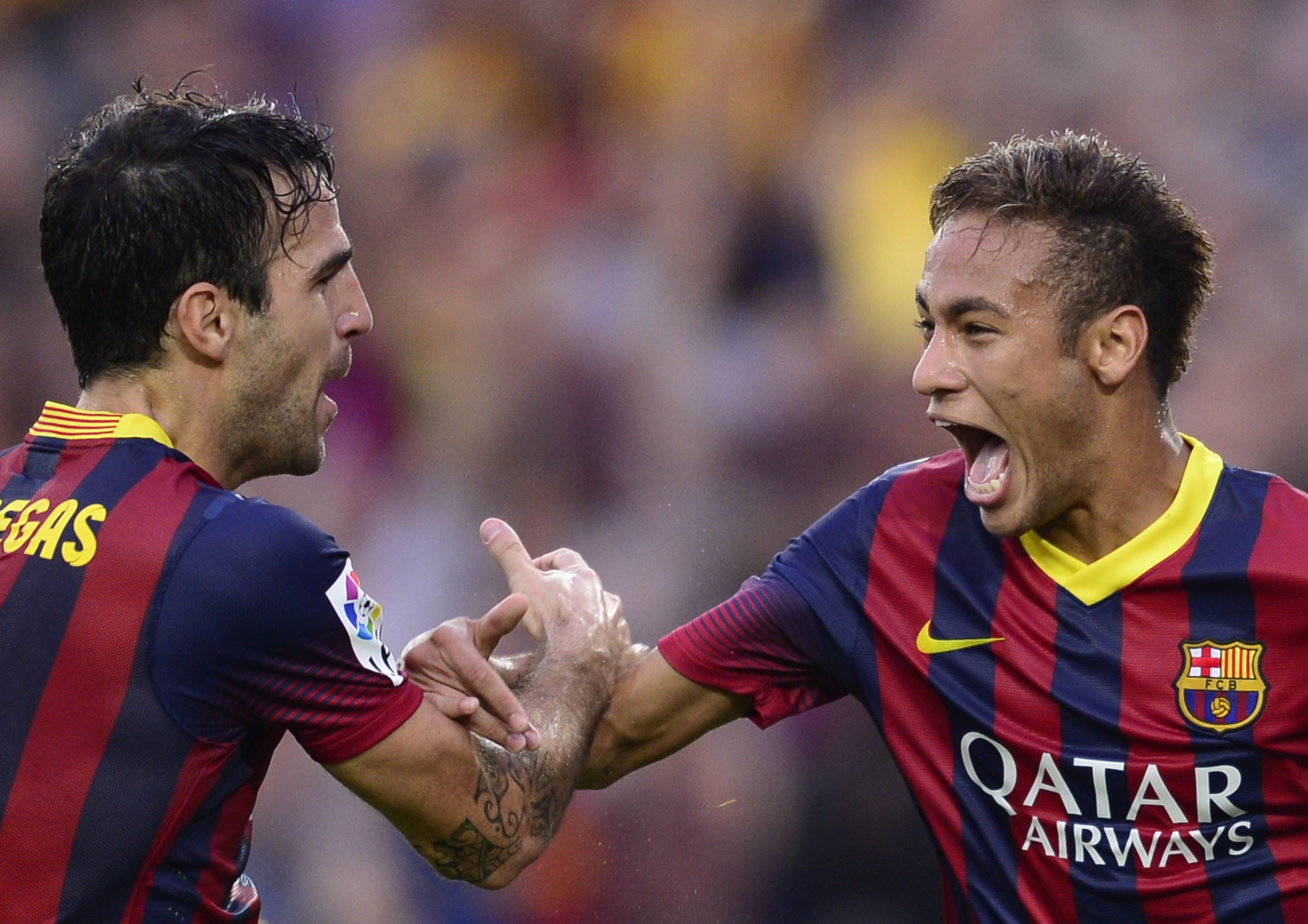 Cesc Fabregas and Neymar celebrate