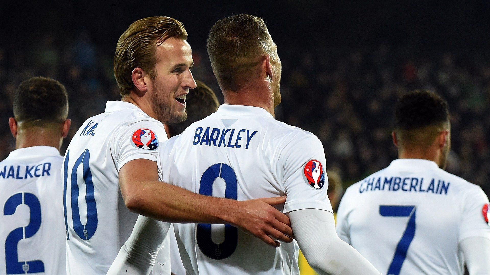 England players celebrate after scoring versus Lithuania