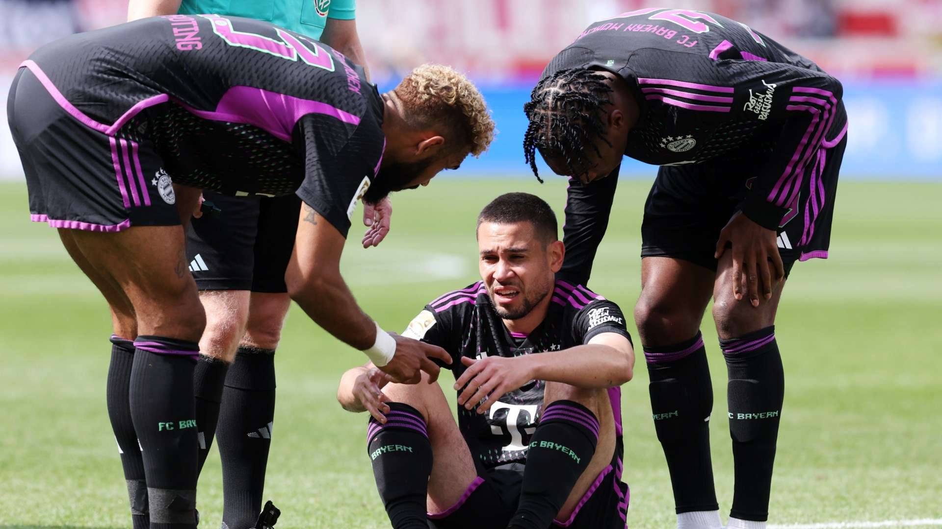 Raphael Guerreiro suffers an injury during Bayern Munich's game against Stuttgart