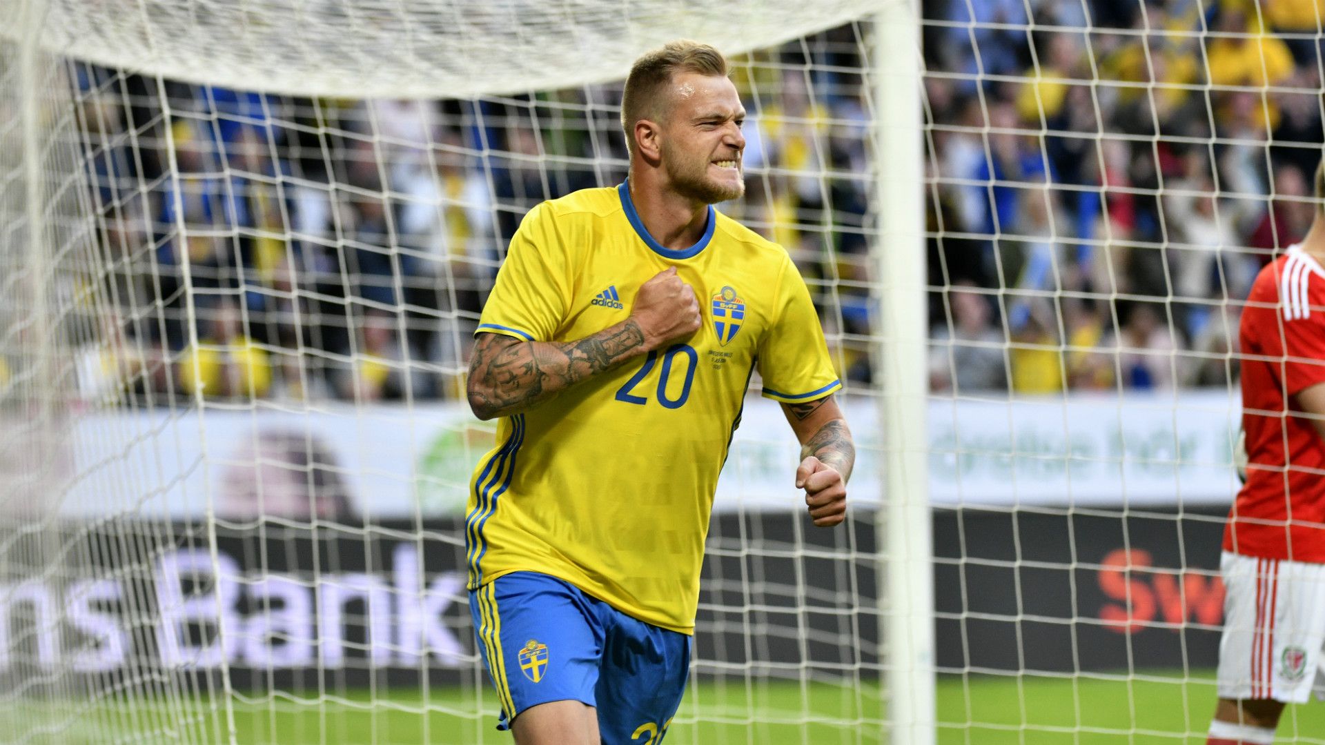 John Guidetti of Sweden scores the decisive goal against Wales to win 3-0