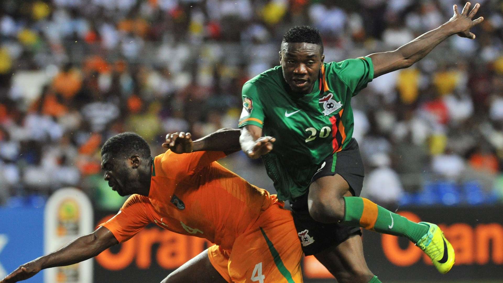 Ivory Coast's national football team defender Abib Kolo Toure (L) vies for the ball with Zambian Emmanuel Mayuka during the 2012 Africa Cup of Nations final