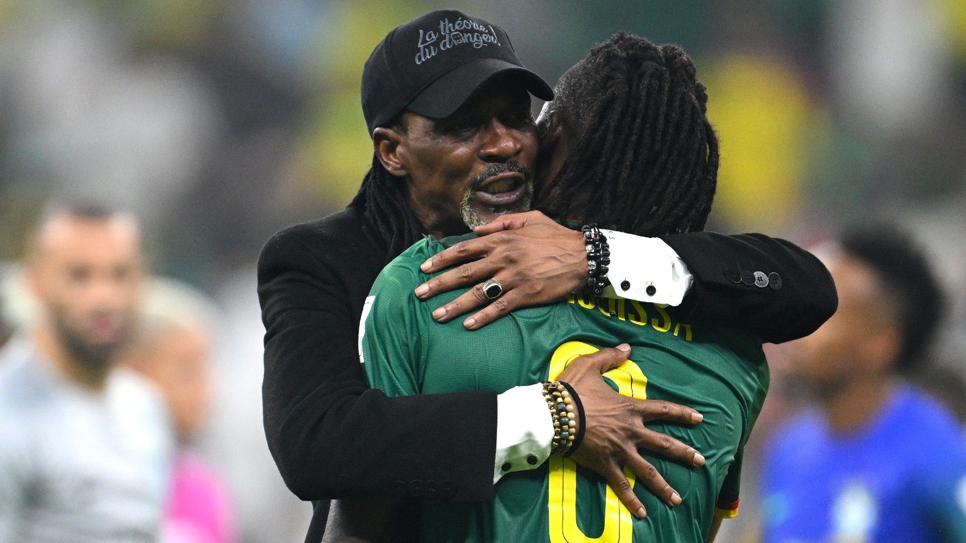 Rigobert Song embraces Andre-Frank Zambo Anguissa of Cameroon