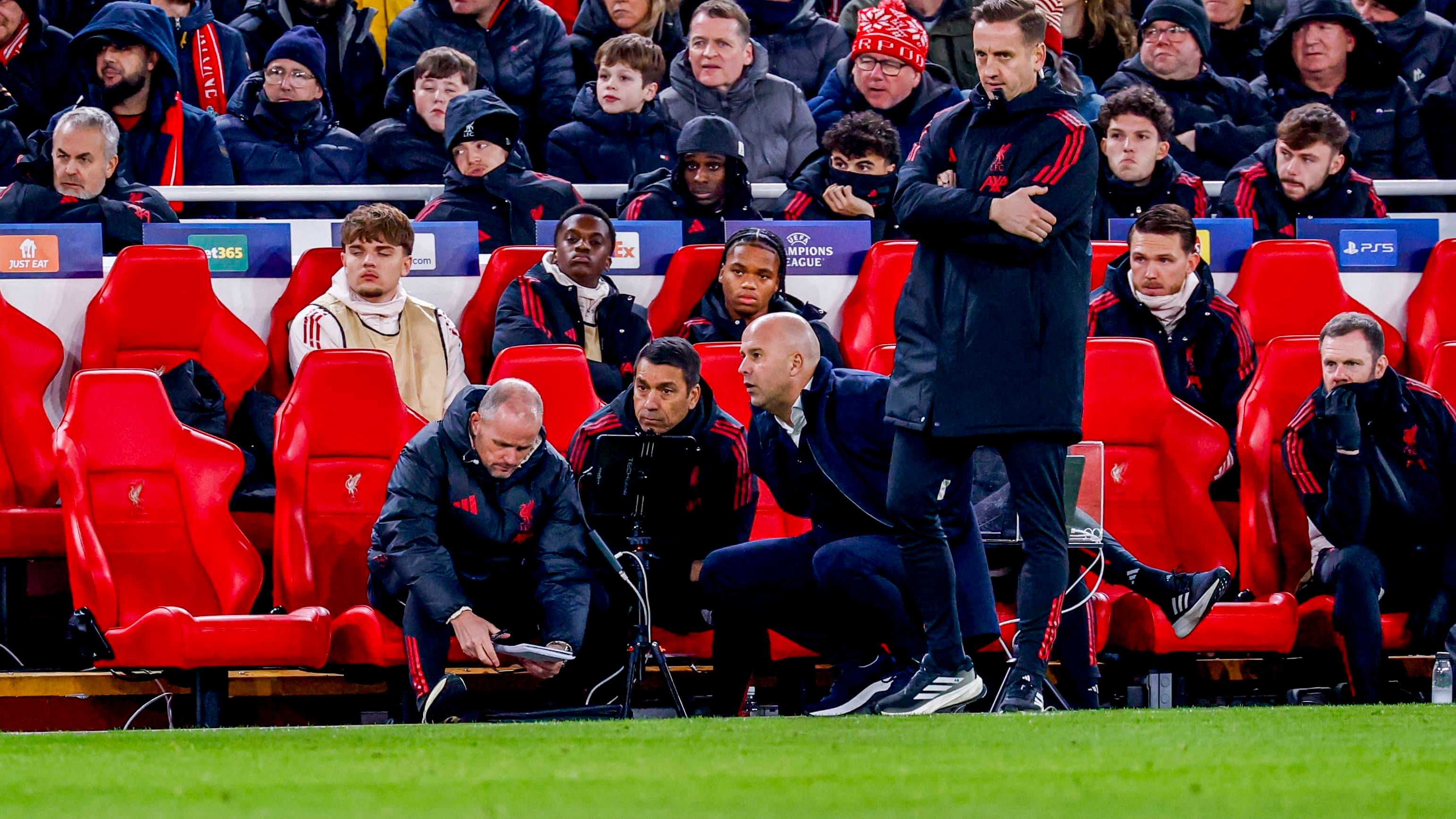 assistant coach Sipke Hulshoff of Liverpool FC and assistant coach Giovanni van Bronckhorst of Liverpool FC and head coach Arne Slot of Liverpool FC in discussion Liverpool FC v PSV Eindhoven, UEFA Champions League 2025 26 League Phase MD5, Liverpool FC v PSV Eindhoven, Anfield, November 26, 2025, Liverpool, United Kingdom.